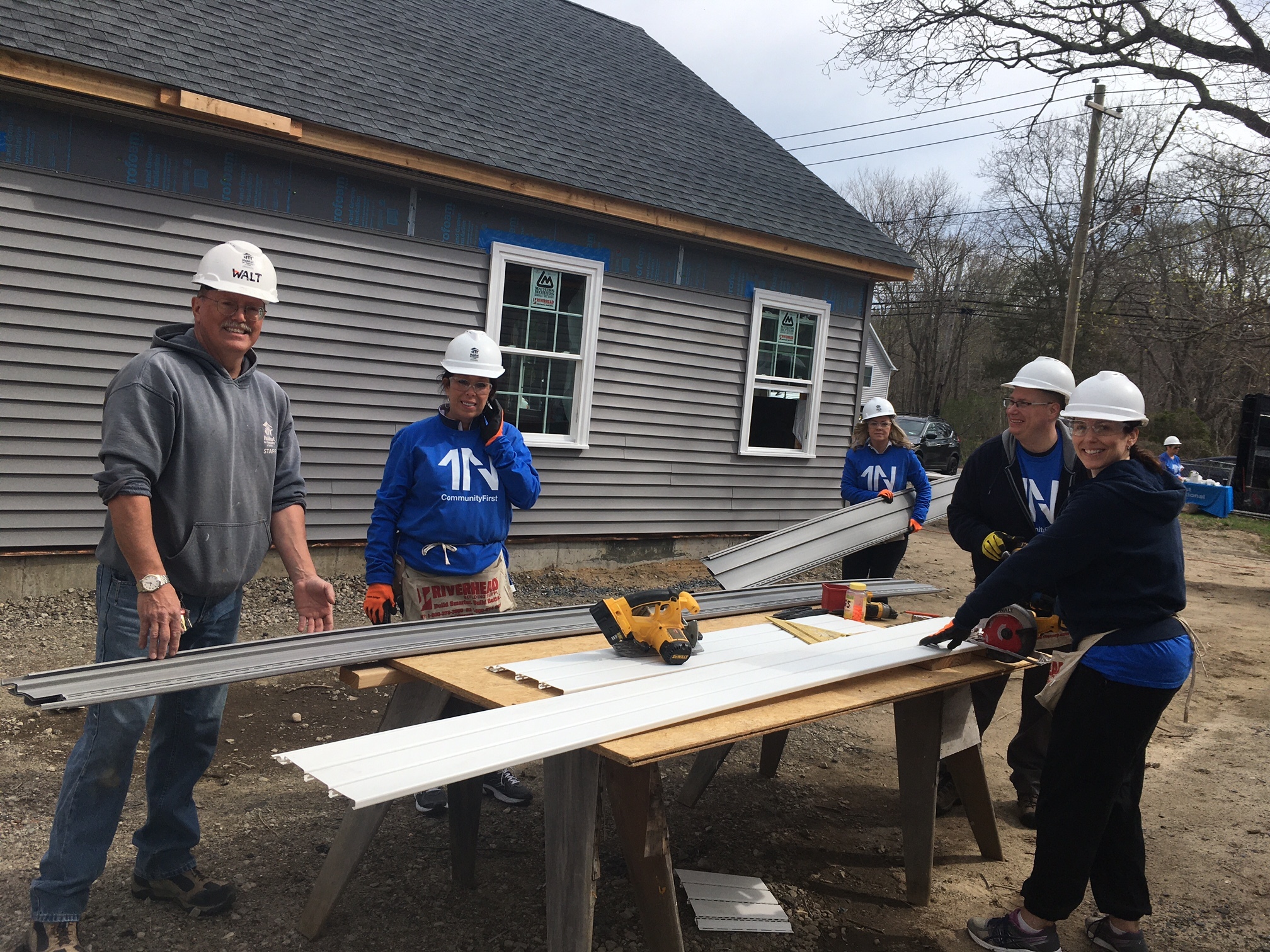 Volunteers work on one of Habitat for Humanity's affordable houses in Riverside. The Southampton Town Board is discussing  the proposed Community Housing Fund.      KITTY MERRILL
