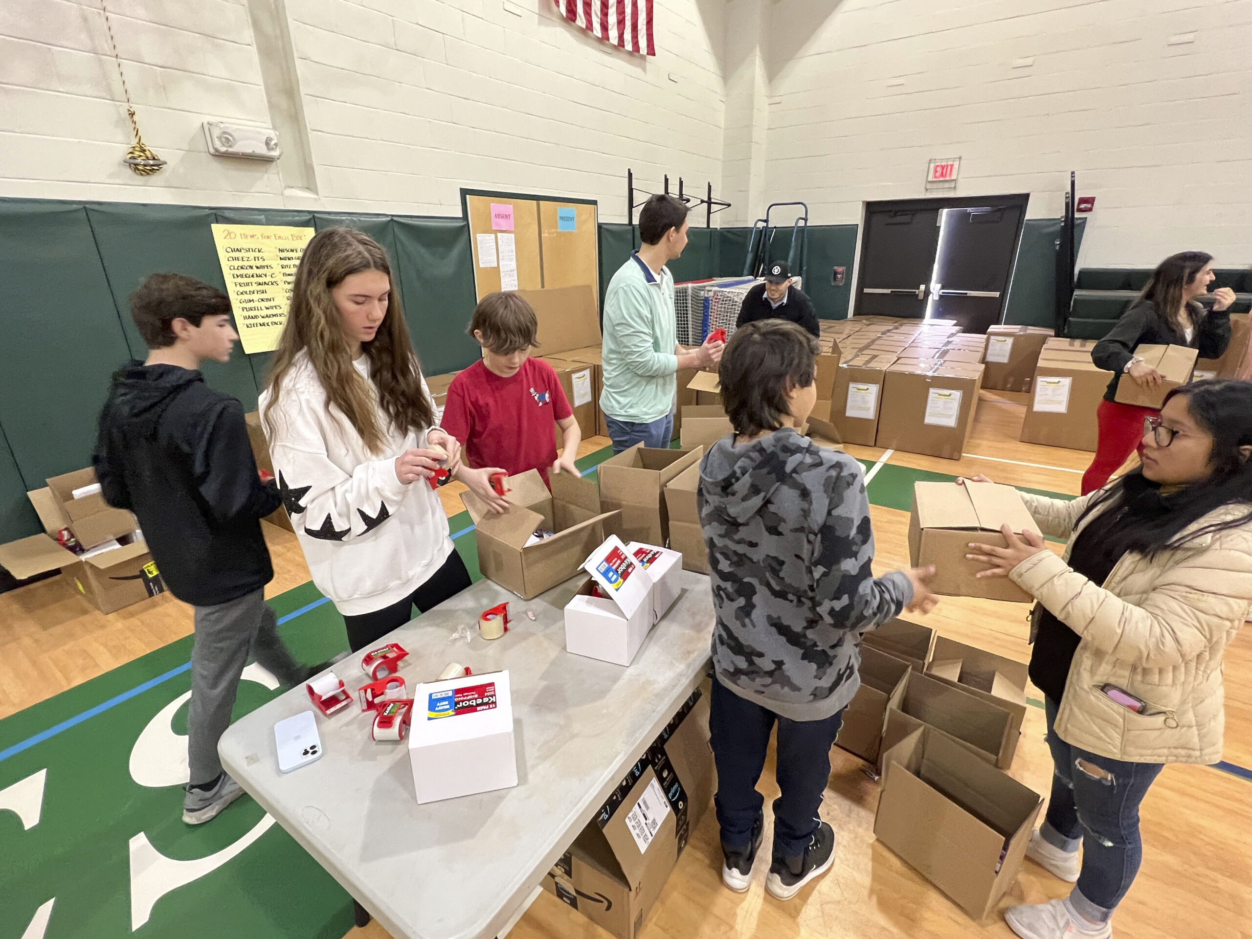 Students at Westhampton Beach Middle School put together care packages for the Ukraine Military on Thursday morning.  Over 1000 packages were made up on Wednesday and Thursday. The event coordinated by the school, Rocco A. Carriero Wealth Partners and iloveukraine.org.  DANA SHAW