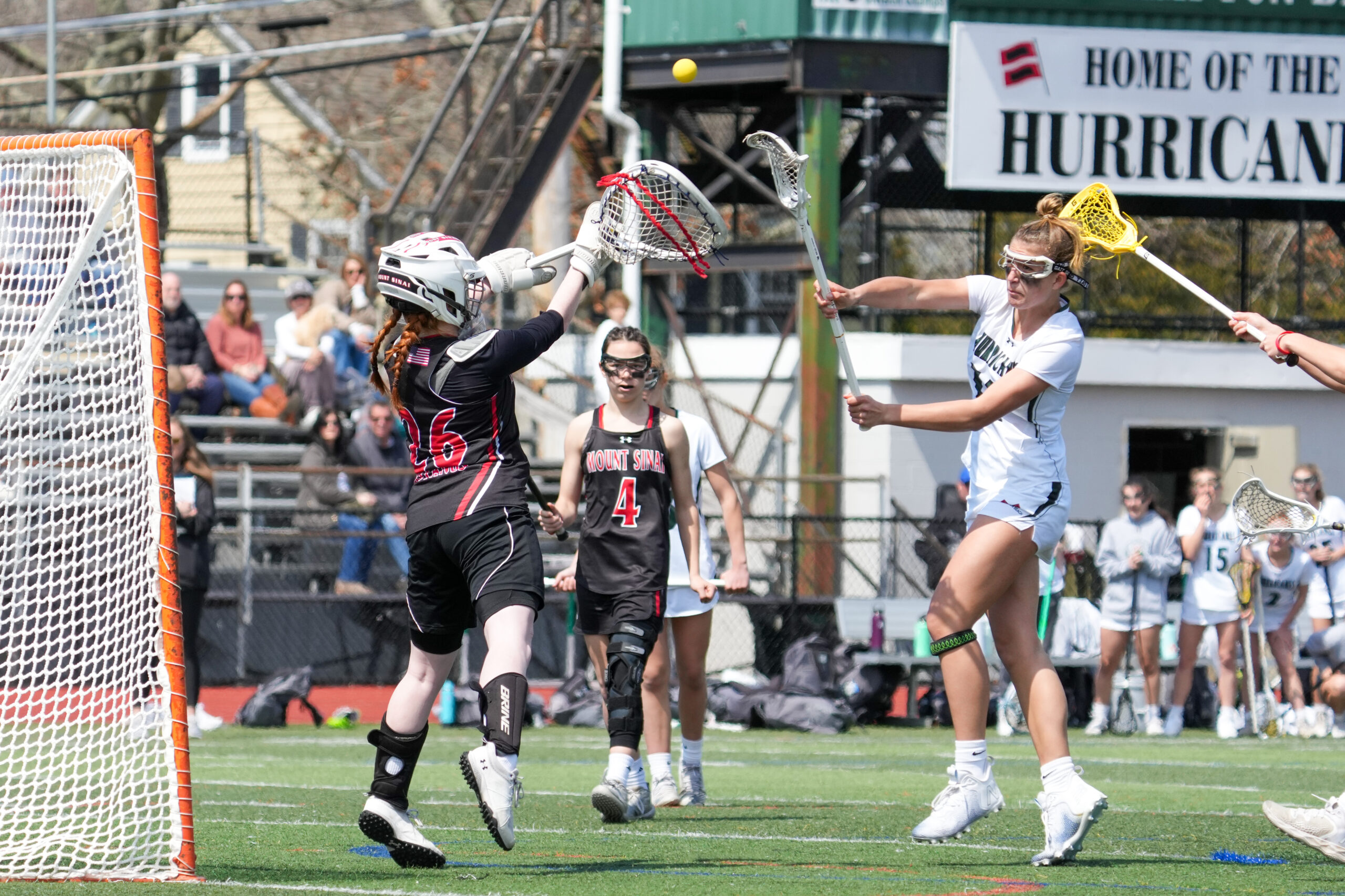 Freshman Reese King shoots over Mt. Sinai goalkeeper Jillian McFadden's stick. RON ESPOSITO