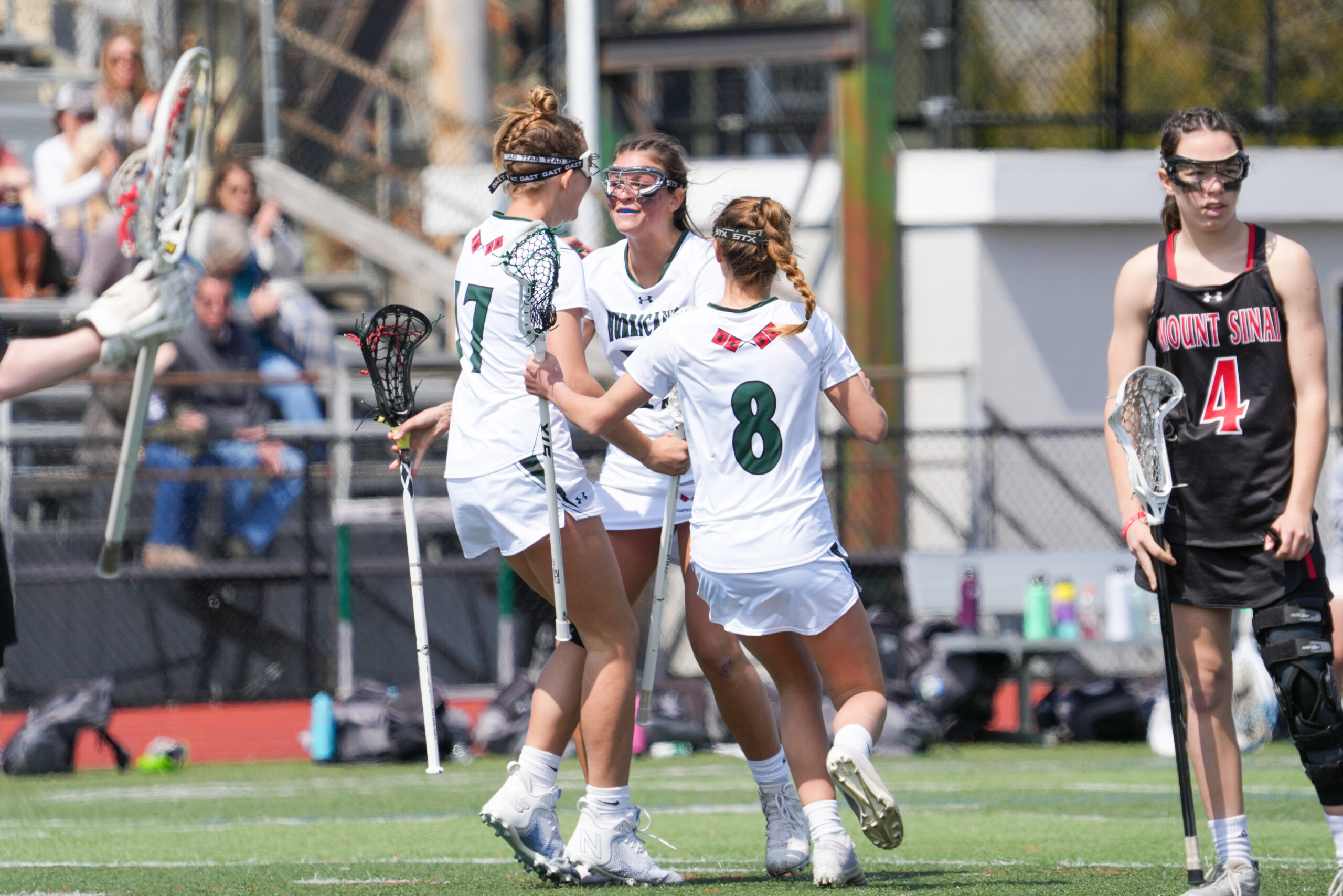 Freshman Reese King, senior Olivia Rongo and eighth-grader Ava Derby celebrate a goal. RON ESPOSITO