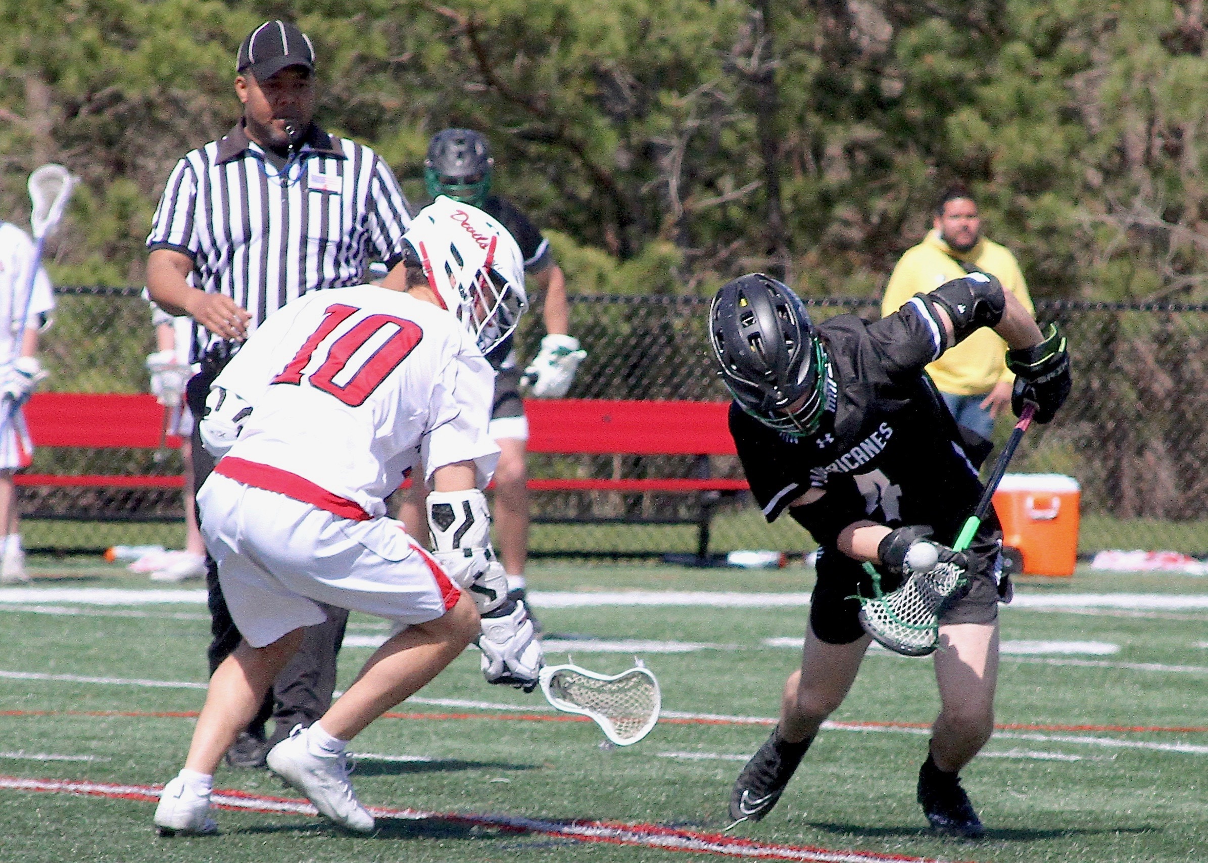 Sophomore midfielder Nolan Michalowski scoops up possession on the faceoff. DESIRÉE KEEGAN