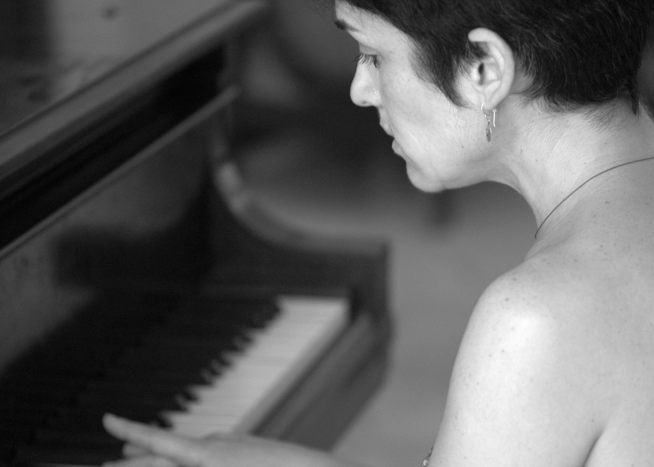 Adelaide Mestre with her late father's piano in Cuba. COURTESY ADELAIDE MESTRE