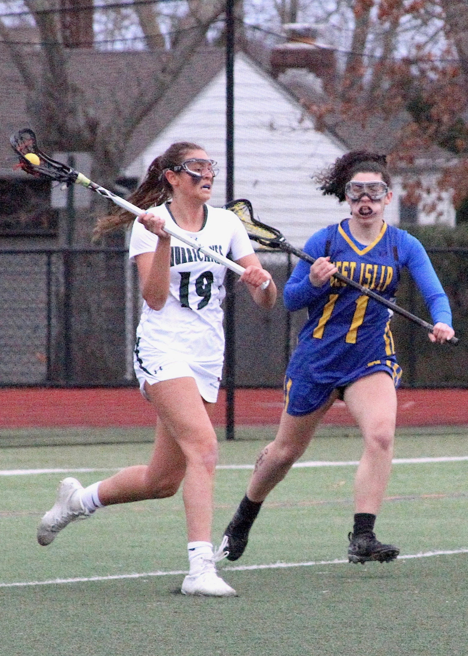 Westhampton Beach senior Olivia Rongo looks to make a pass in front of the cage. DESIRÉE KEEGAN