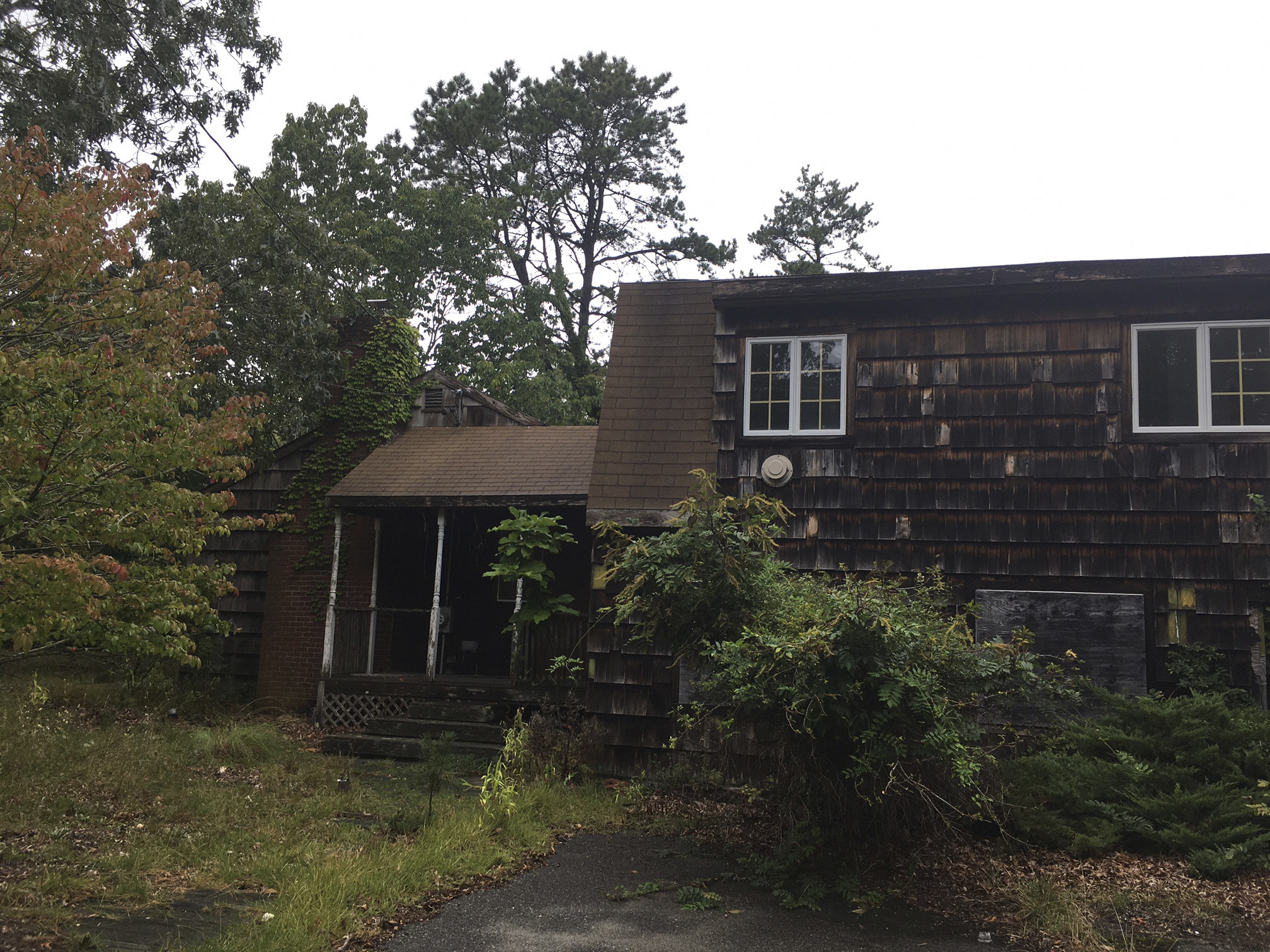 The Town Board moved forward with a transfer that will lead to the demolition of the caretaker's cottage at Camp Tekakwitha in Hampton Bays.