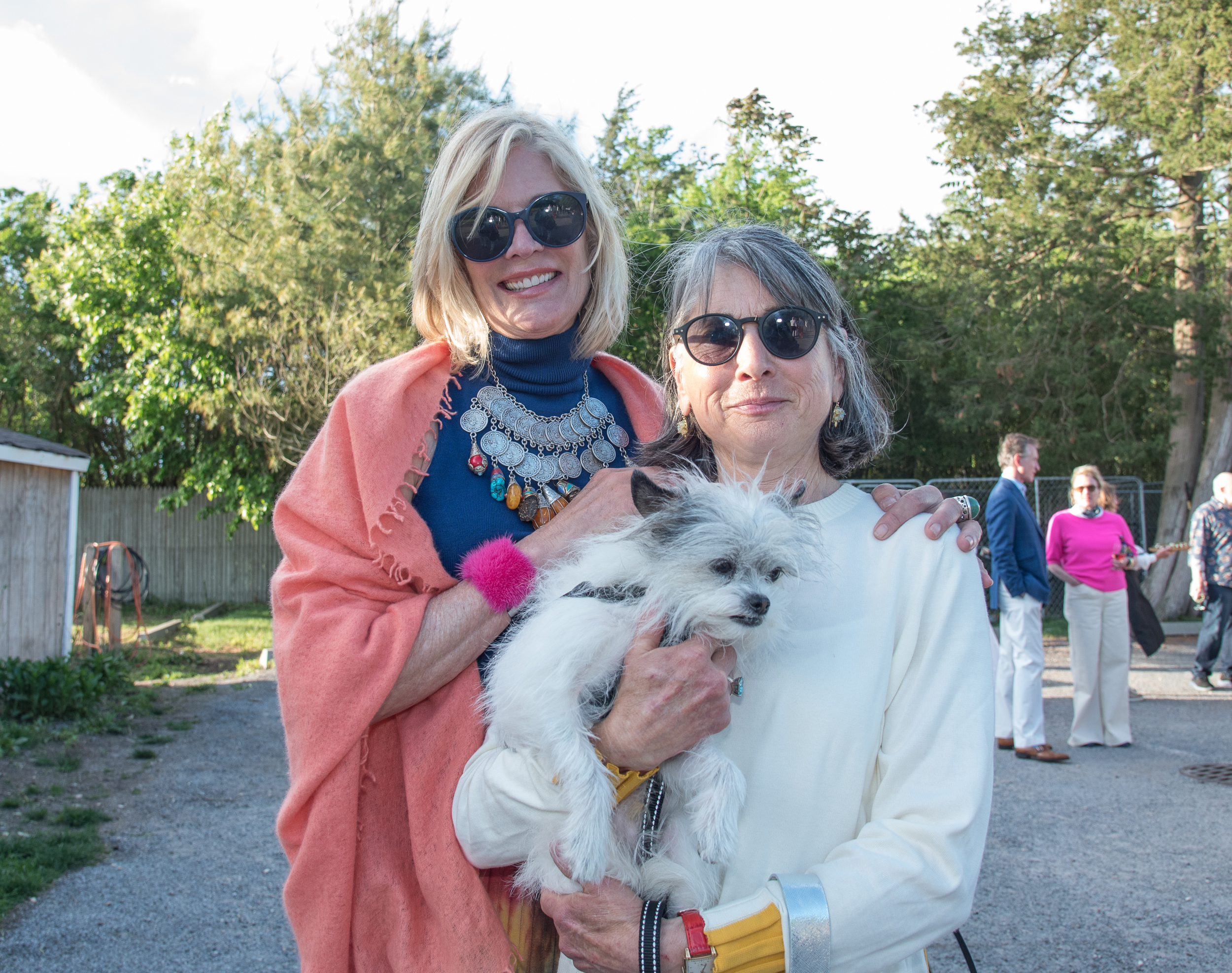 Laurie Sykes and Susan Macy with Biggie at the  Animal Rescue Fund of the Hamptons preview cocktail party for the benefit designer auction on Saturday evening at the ARF Thrift & Treasure Shop in Sagaponack. The online auction will run through June 7 and feature furniture and decorative items for the home donated by longstanding friends and ARF supporters, including some of the most admired designers, artisans, and dealers in the country.  LISA TAMBURINI