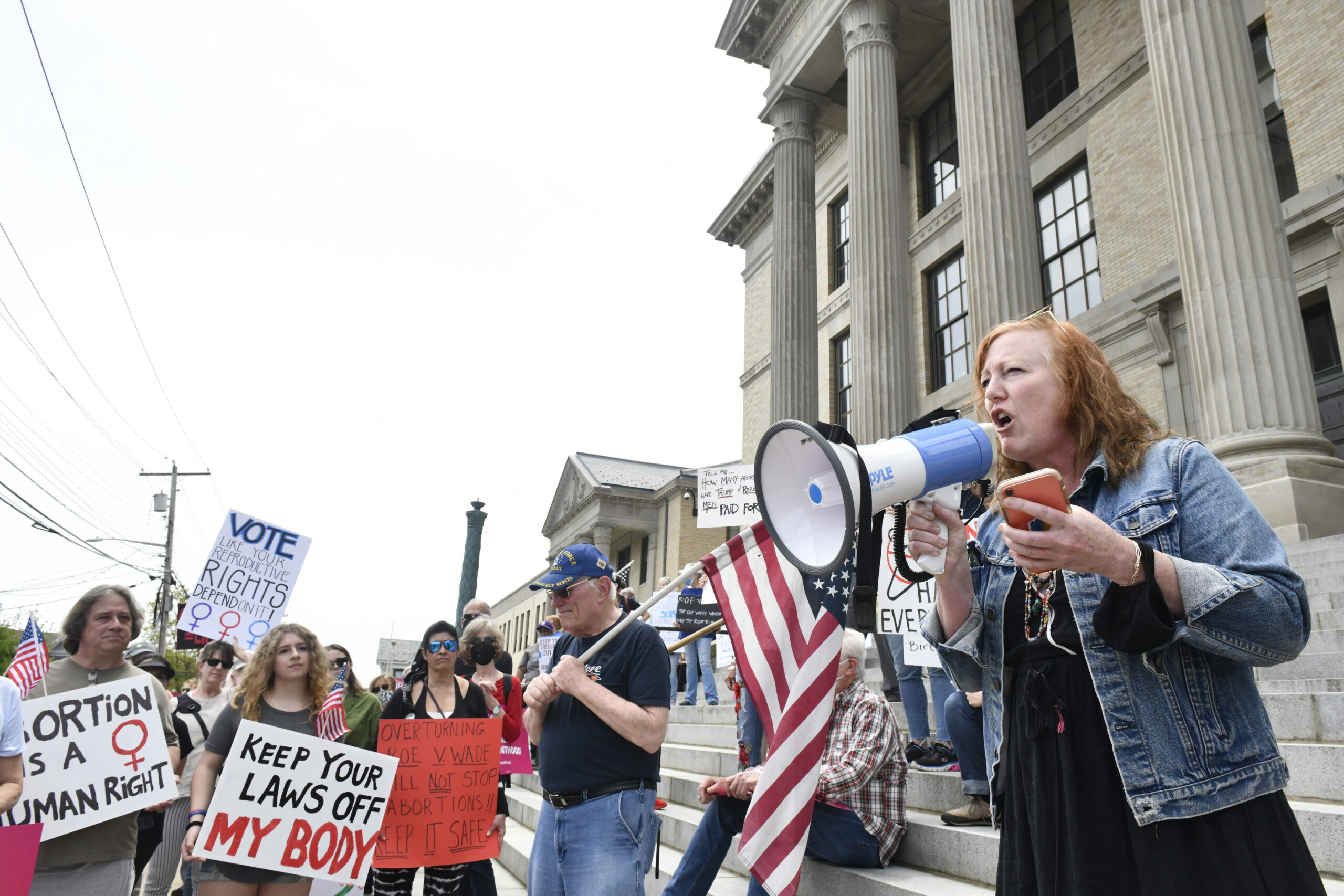 Kate Mueth of the Neo-Political Cowgirls speaks at the rally on Saturday.  DANA SHAW