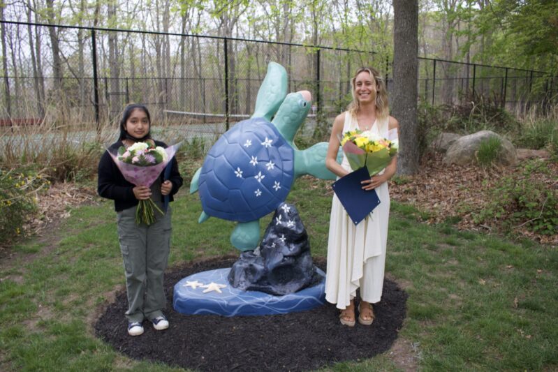 The Village of North Haven unveiled a sea turtle statue outside Village Hall on May 14. The turtle was custom painted by local artists Rosy Hernandez, left, and Melody Guini.