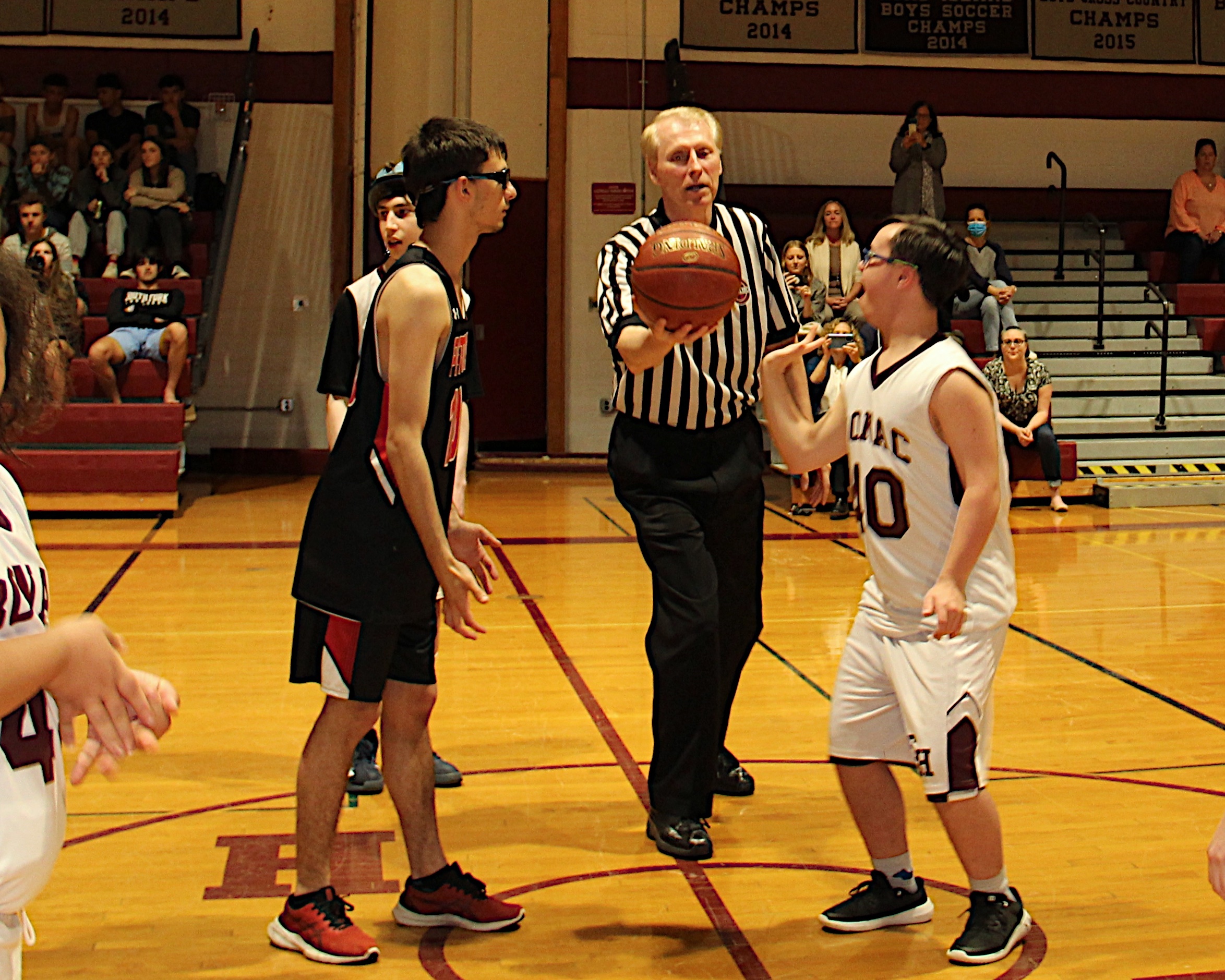 Official Scott Johnson get set for the opening tip-off.   KYRIL BROMLEY