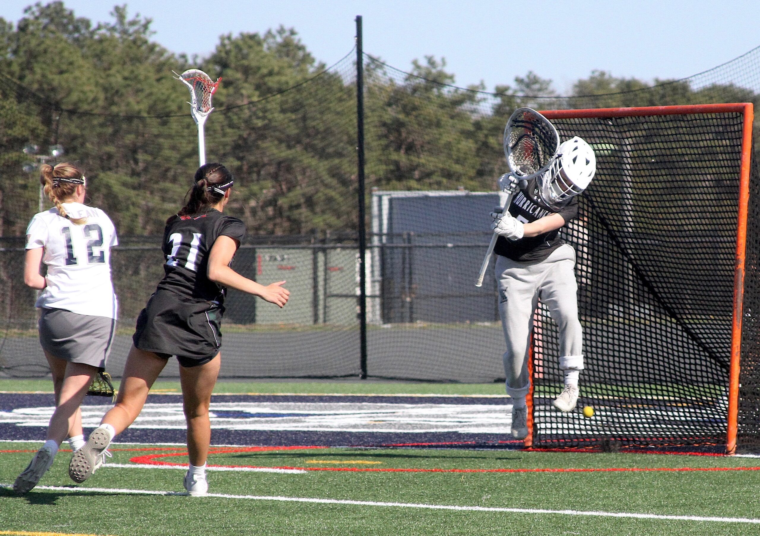 Freshman goalkeeper Maya Farnan makes a save by jumping to deflect the ball off her feet. DESIRÉE KEEGAN