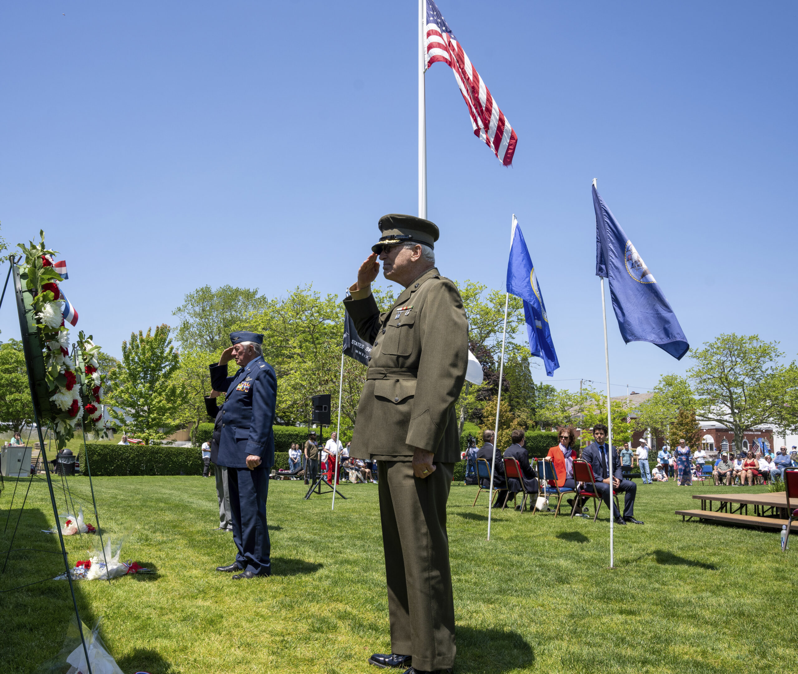 Bob Grisnik and Marty Gilmartin place the wreaths at the memorial in Agawam Park.   RON ESPOSITO