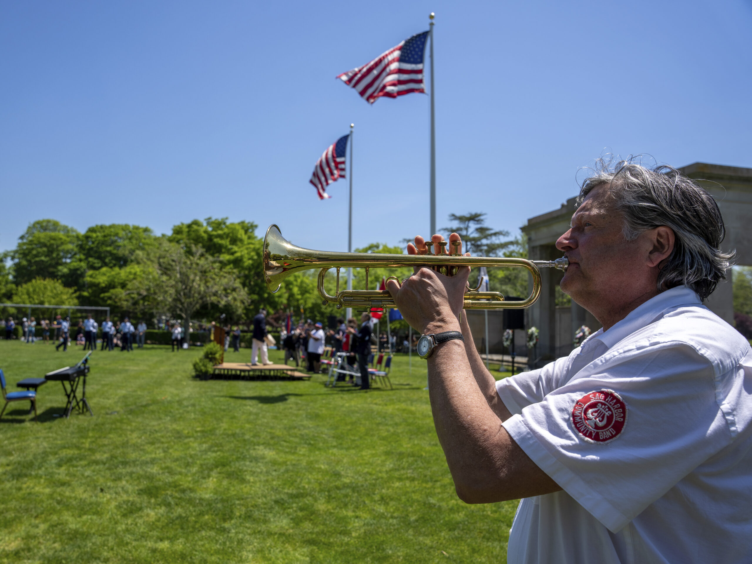 Taps is played at the Memorial Day service in Agawam Park.  RON ESPOSITO