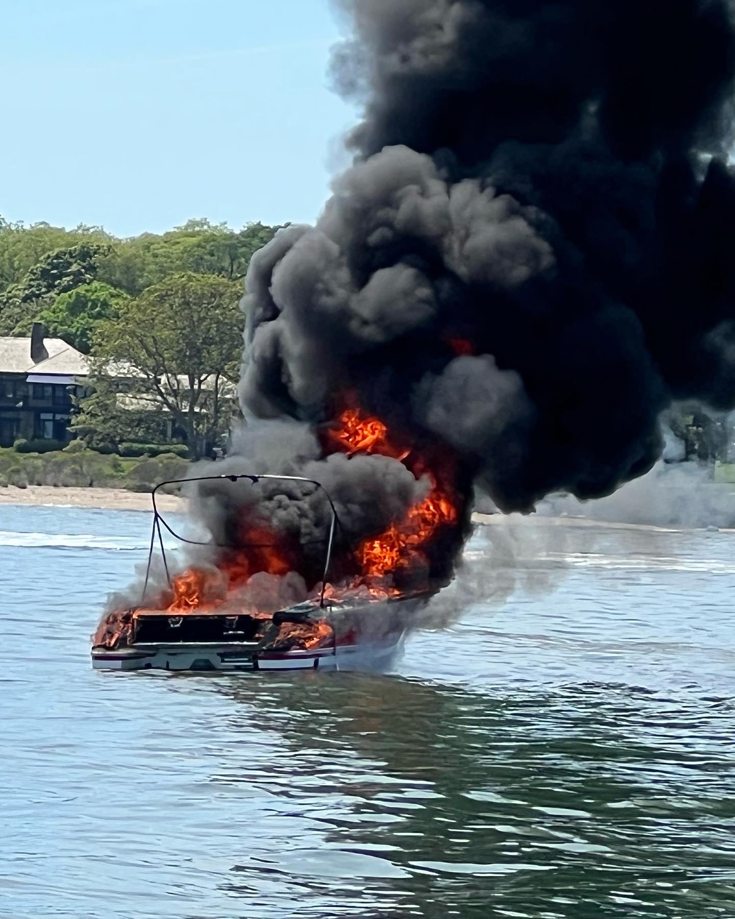 A small boat went up in flames off North Haven Manor on Sunday afternoon, and eventually sank. One female, the only passenger, was rescued. JIM WILLIAMS