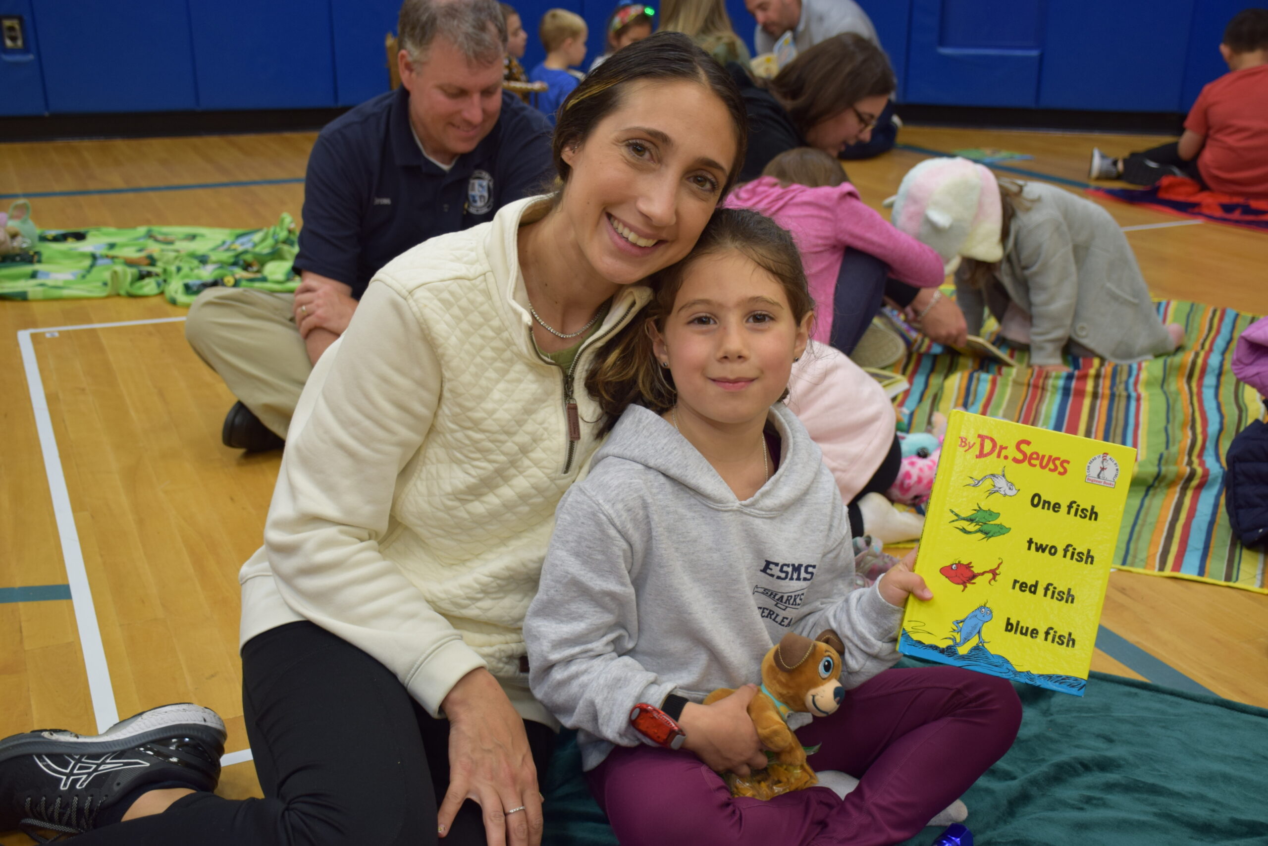 Lea Esposito and her daughter Stella read Dr. Seuss during Reading Campfire Night at South Street Elementary School. COURTESY EASTPORT-SOUTH MANOR SCHOOL DISTRICT