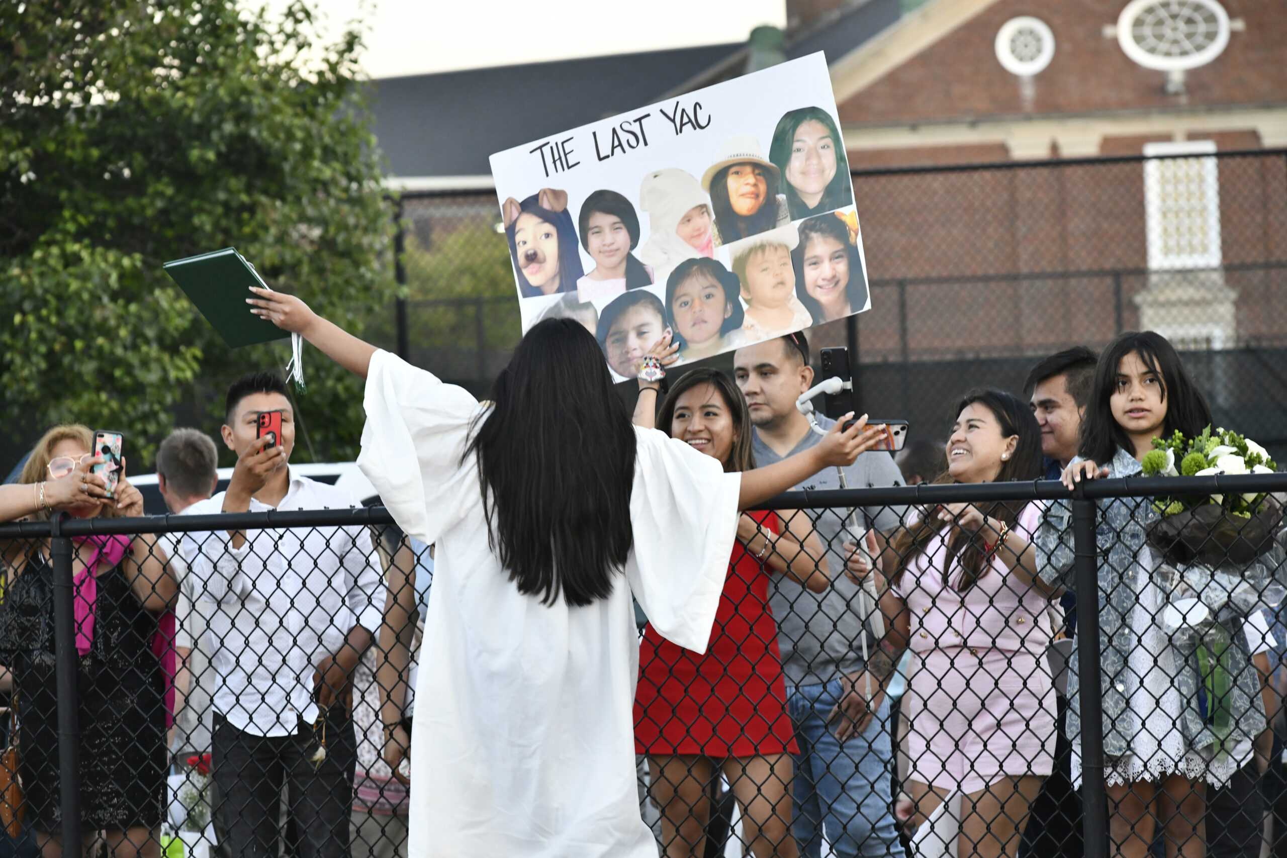 Helen Yac Xiquin has her own cheering section at graduation.