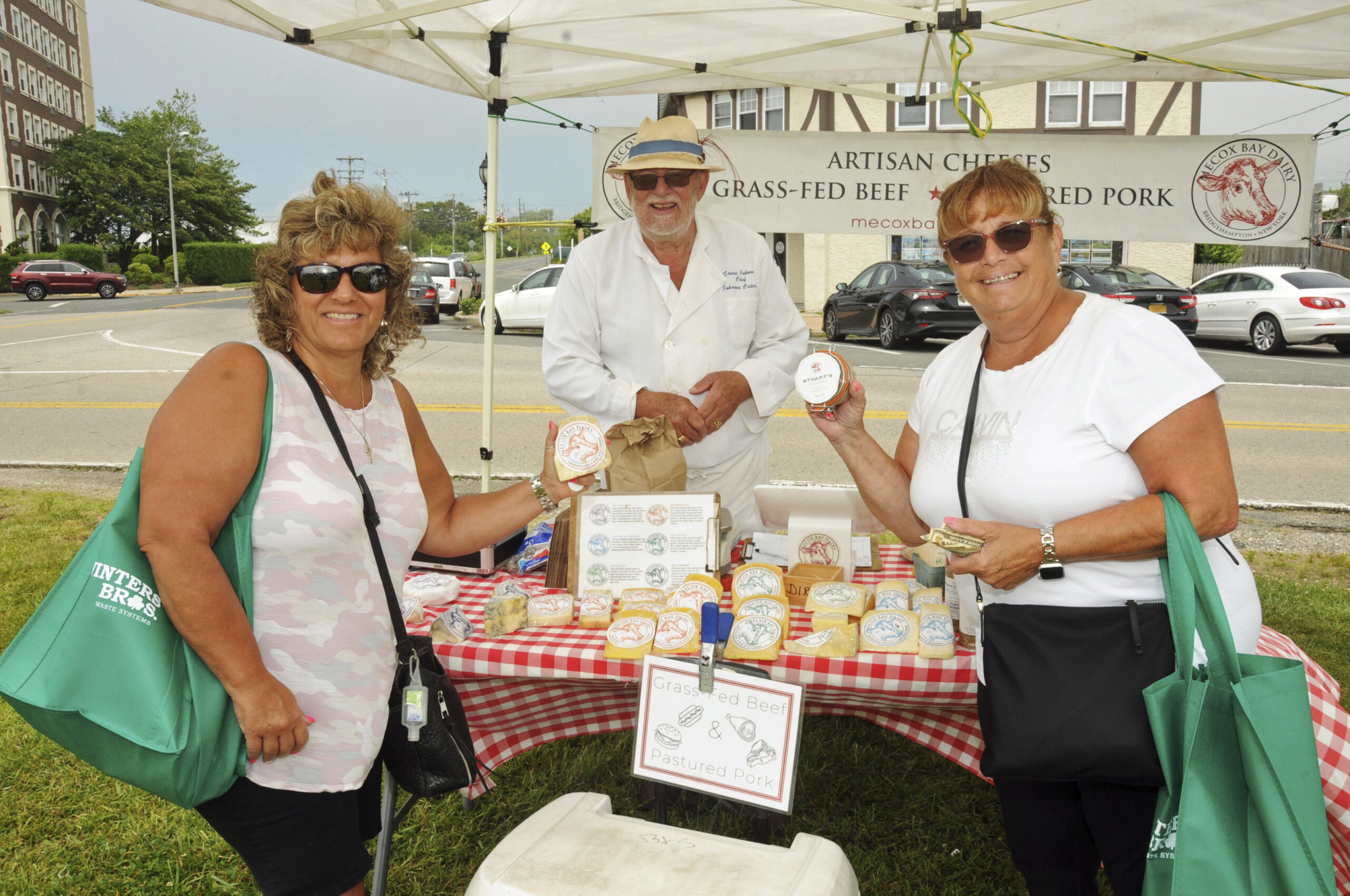 Doreen Cantalino, Stuart Johnsen and Cathy Peragine at the opening day of the Montauk Farmers Market on June 9.  RICHARD LEWIN