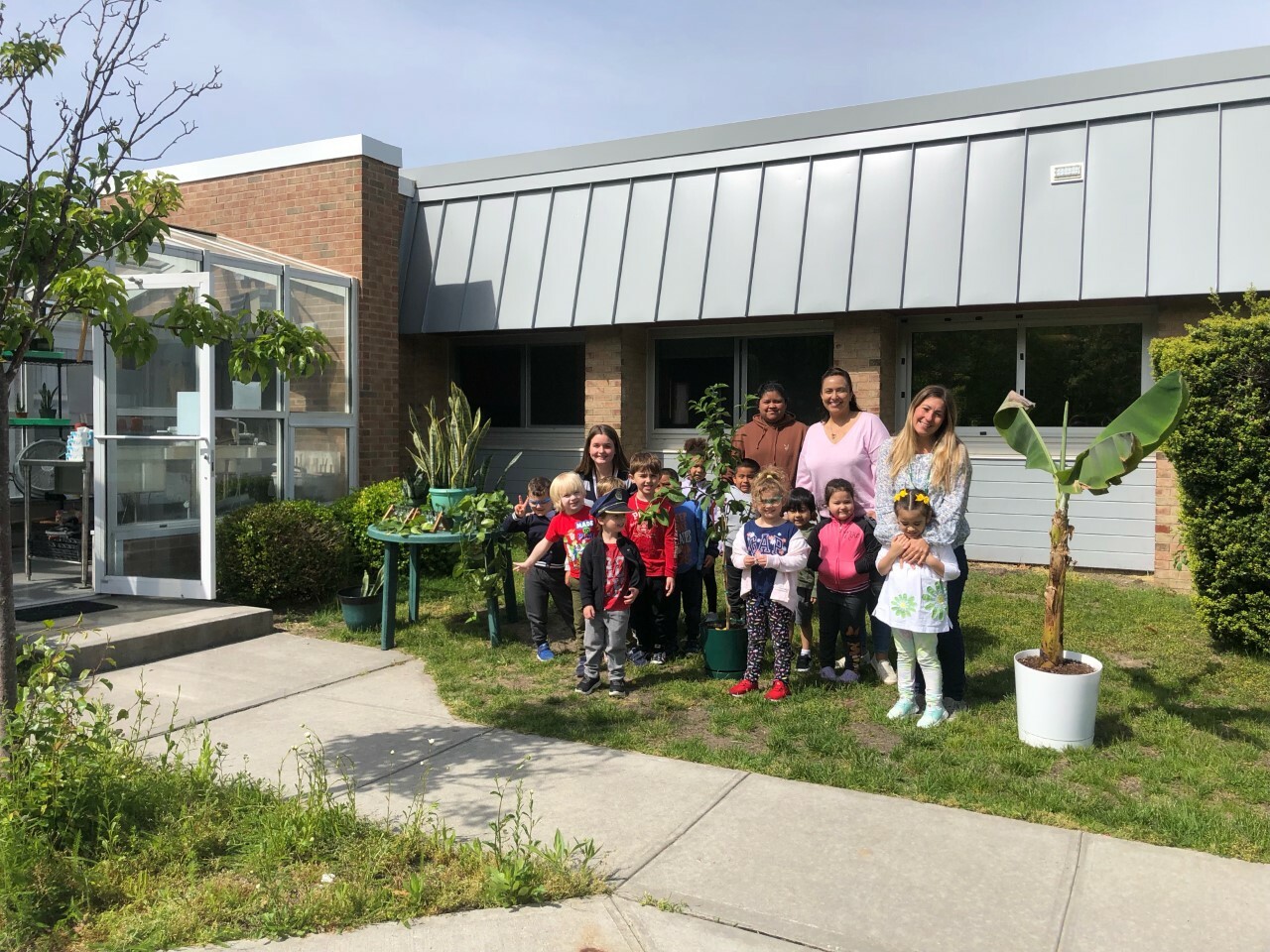 Hampton Bays High School welcomed prekindergartners in the Just for Kids program to the school’s greenhouse on May 26 to support its gardening unit. Led by high school science teacher Dr. Stephanie Forsberg, the students observed and learned about the resident banana plant, lemon tree, and snake and aloe plants. They also brought some plants back to their classroom to tend and grow roots hydroponically. “Hampton Bays is going to have some amazing gardens in the years to come as these budding botanists continue to grow and learn,” said Forsberg. COURTESY HAMPTON BAYS SCHOOL DISTRICT