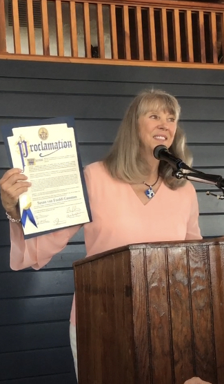 Susan von Freddi was presented with a proclamation from the Town of Southampton for her years of service to the Hampton Bays Beautification Association, during the group's recent garden party. COURTEST HAMPTON BAYS BEAUTIFICATION ASSOCIATION