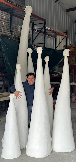 Artist Oscar Molina with some of his sculptural pieces. COURTESY THE ARTIST