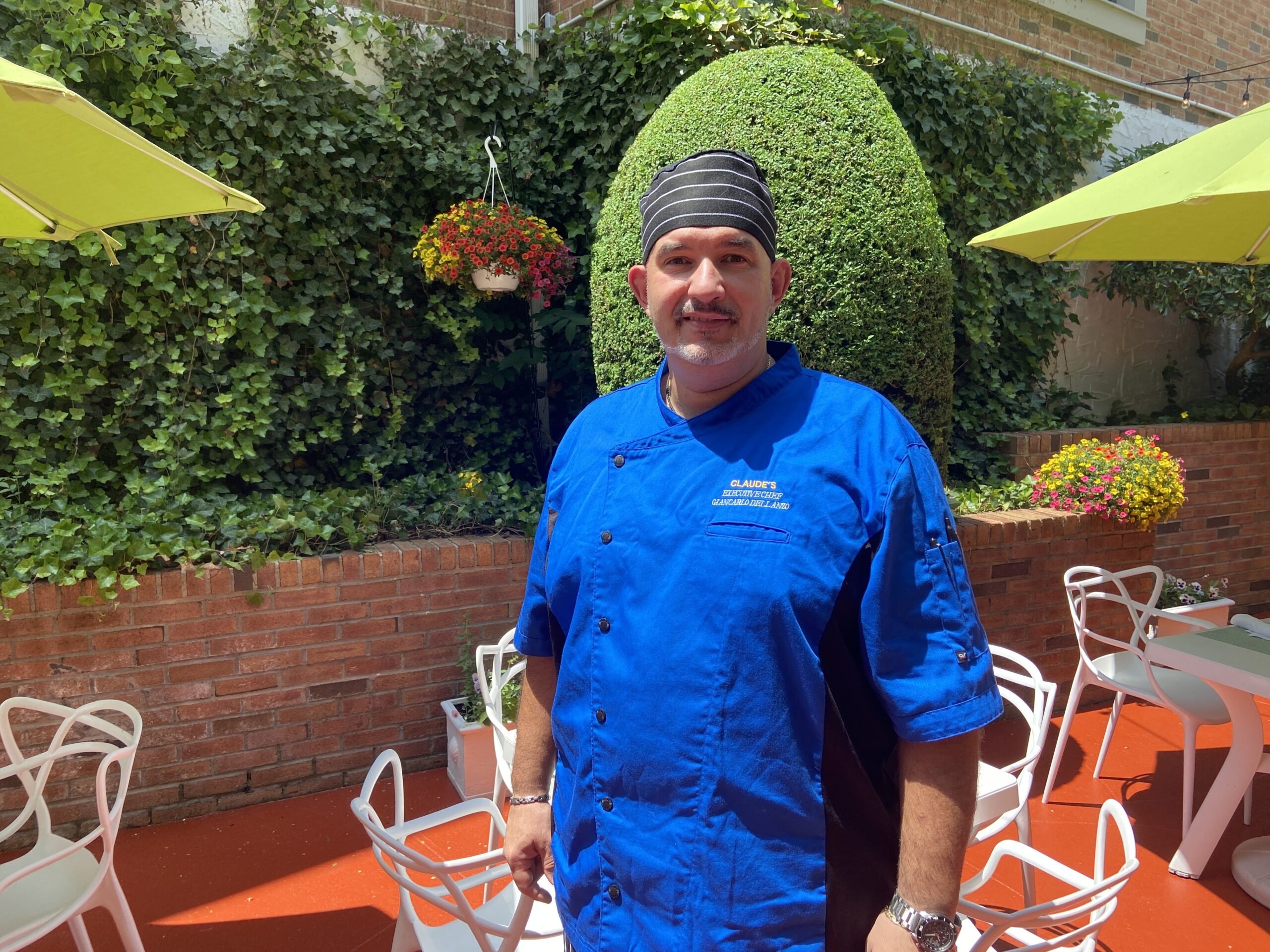 BY JULIA HEMING Chef Giancarlo Dellanzo on the patio at Claude's Restaurant at the Southampton Inn.