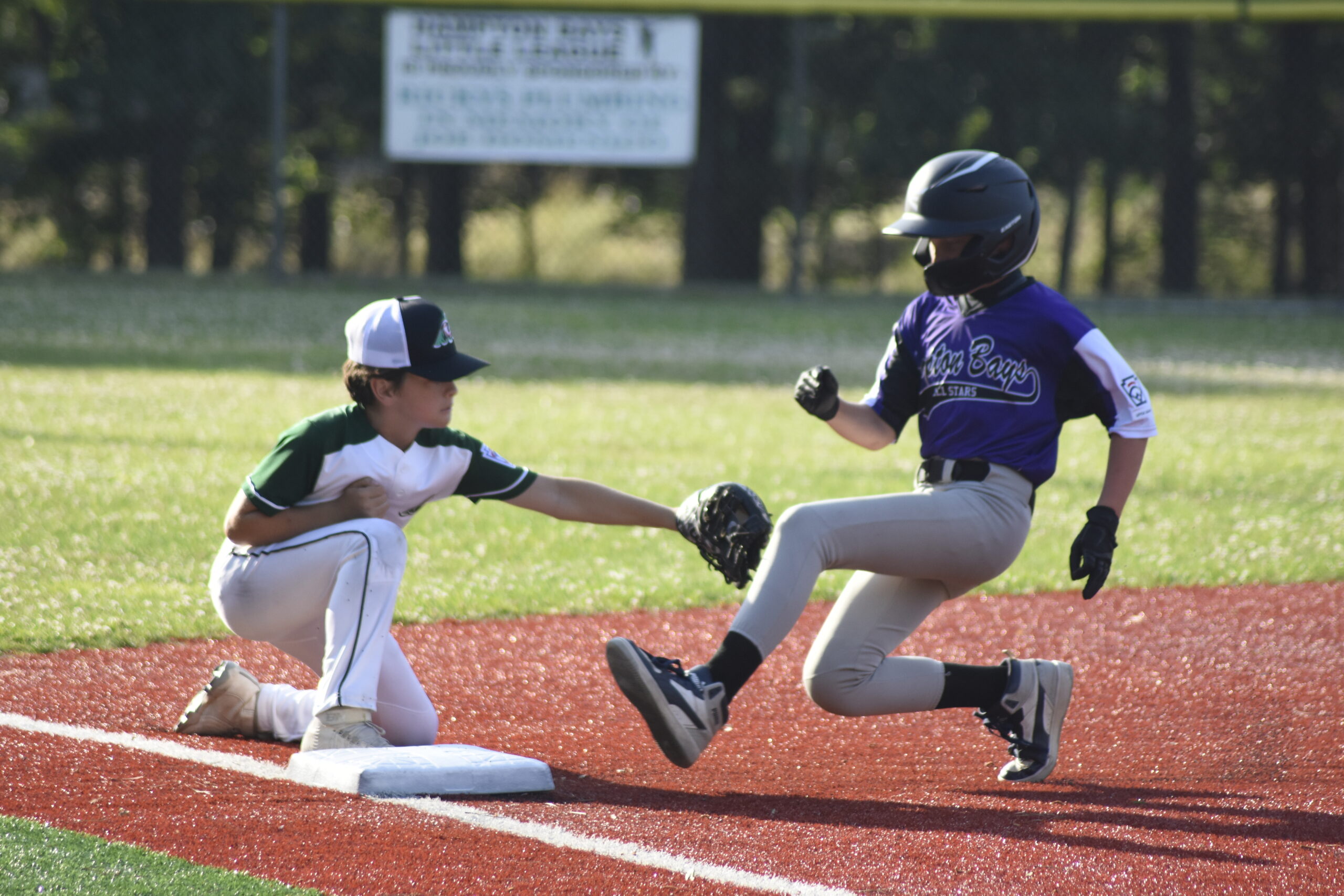 Cole Maag tags out a Henry Rose trying to advance to third on a base hit.    DREW BUDD