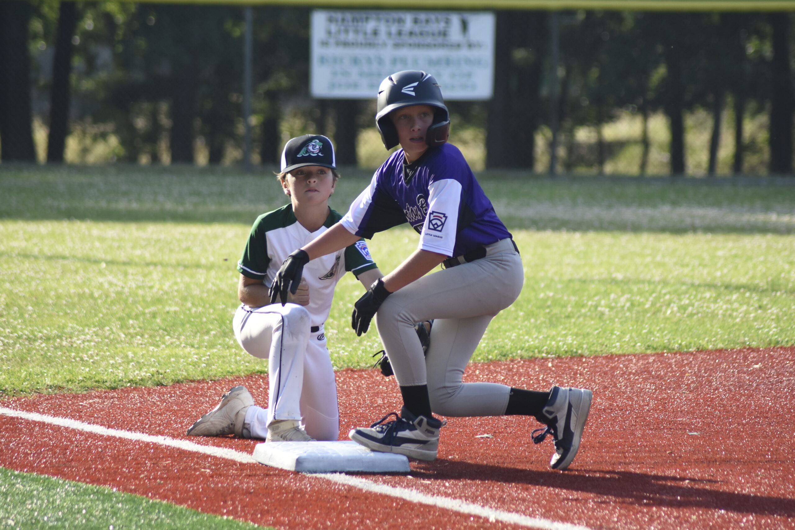 Cole Maag, left, and Henry Rose look for a call from the umpires.    DREW BUDD