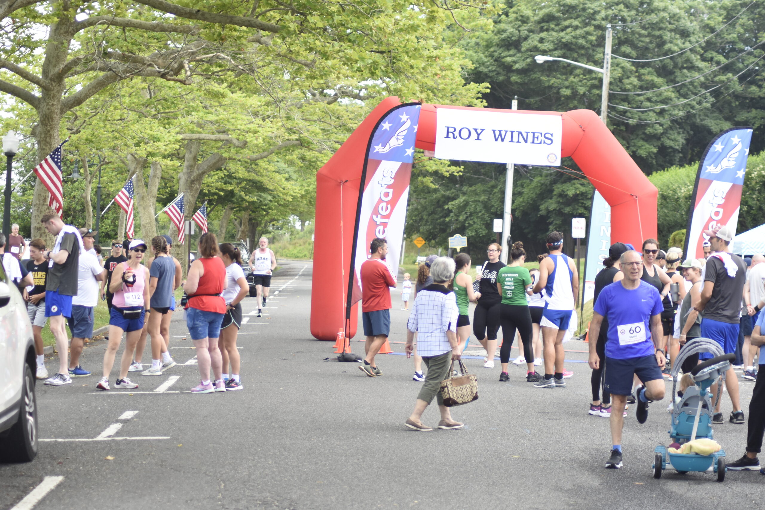 The Roy Wines finish line at the Firecracker 8K in Southampton Village.    DREW BUDD