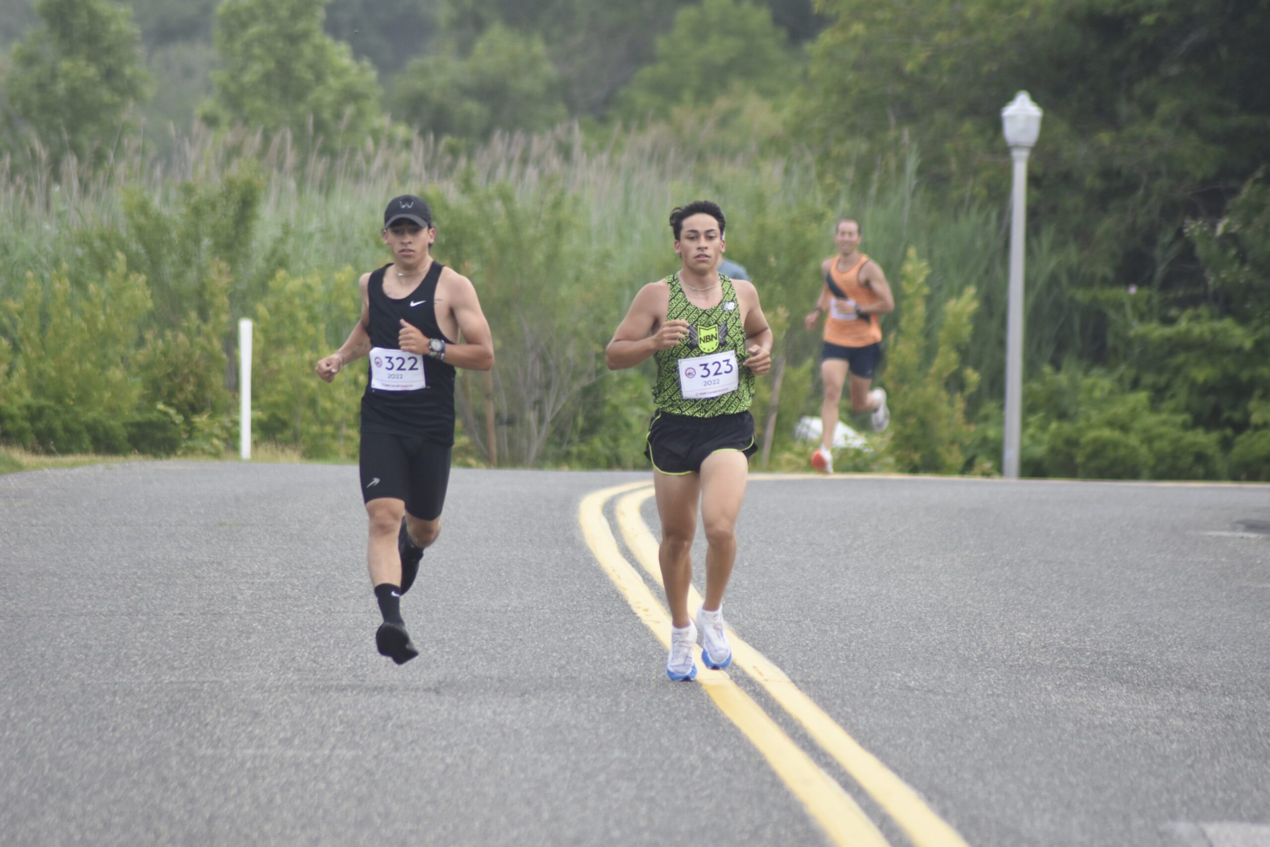 The Loffel Brothers, John, left, and James, led the first half of Sunday morning's race.    DREW BUDD