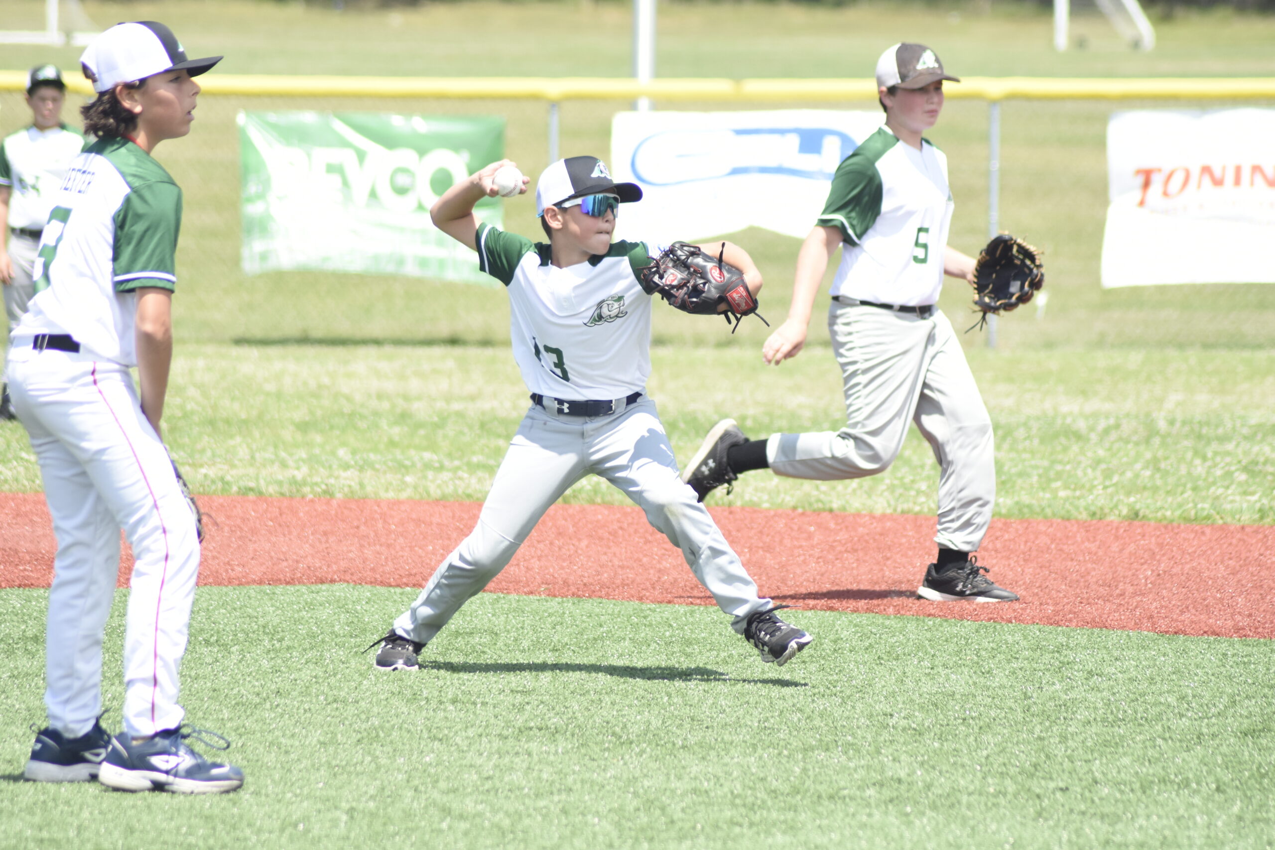 East End second baseman Charlie Blaine throws to first for an out.   DREW BUDD