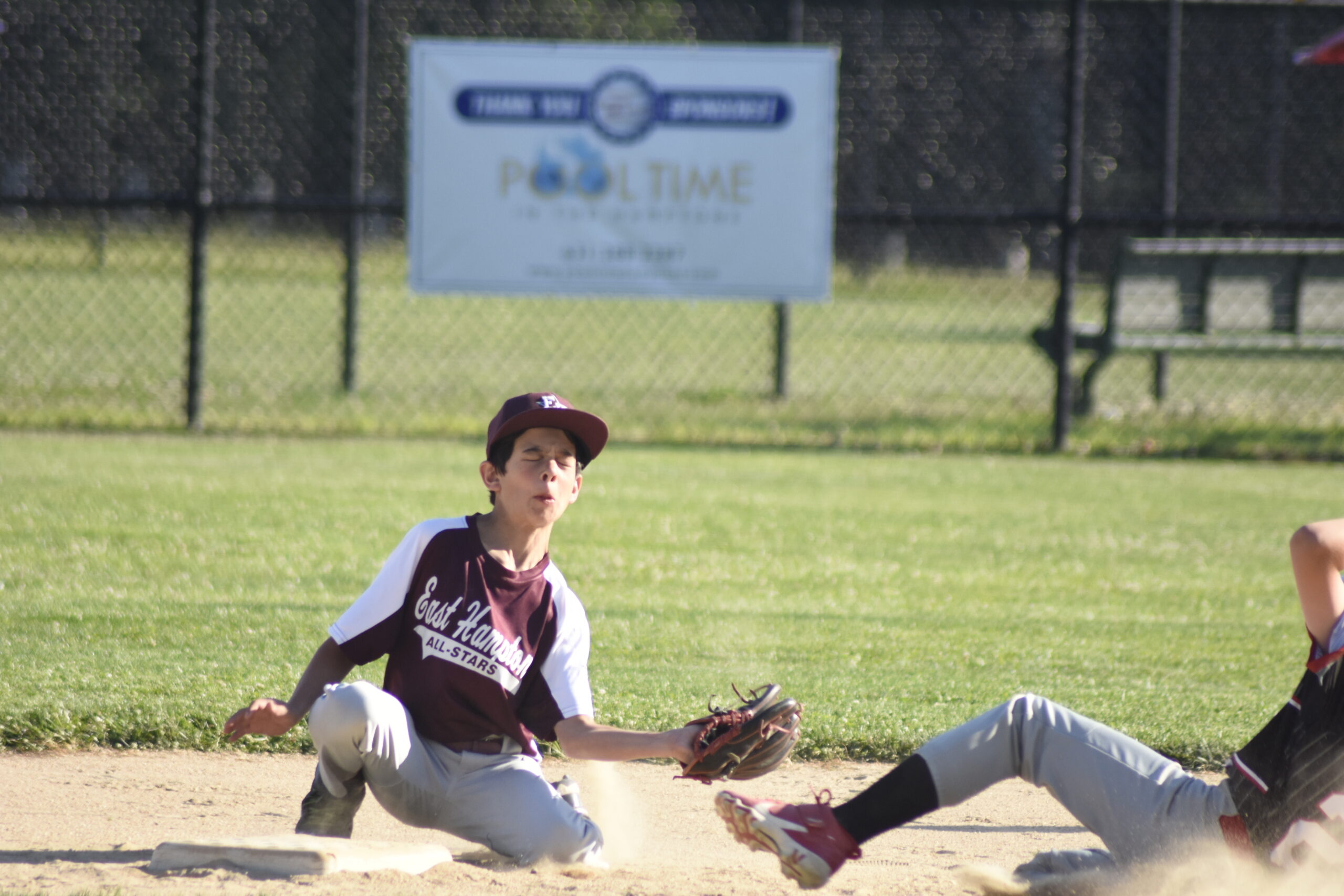 East Hampton's Harry Thomas catches a throw from catcher Elias Wojtusiak and applies a tag to catch a North Patchogue-Medford base runner attempting to steal second base.    DREW BUDD