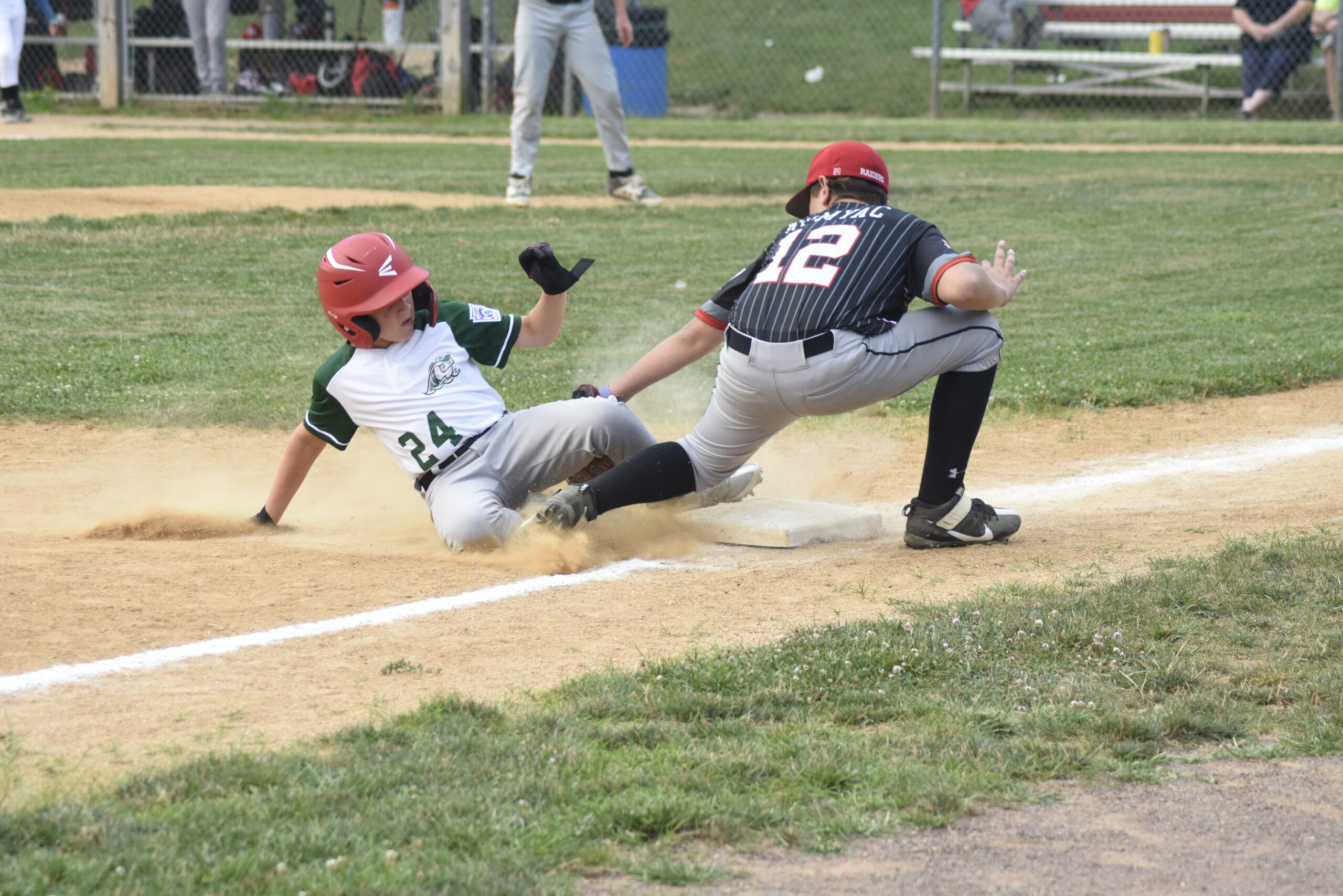 Lukert gets called out on a close play at third base.    DREW BUDD