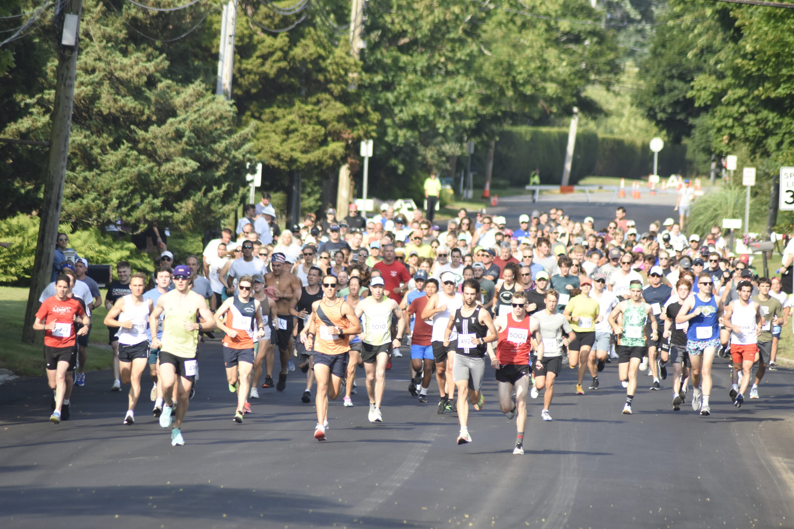 Runners start the 30th live running of the Joe Koziarz Memorial 5K in Westhampton Beach on Saturday morning.    DREW BUDD
