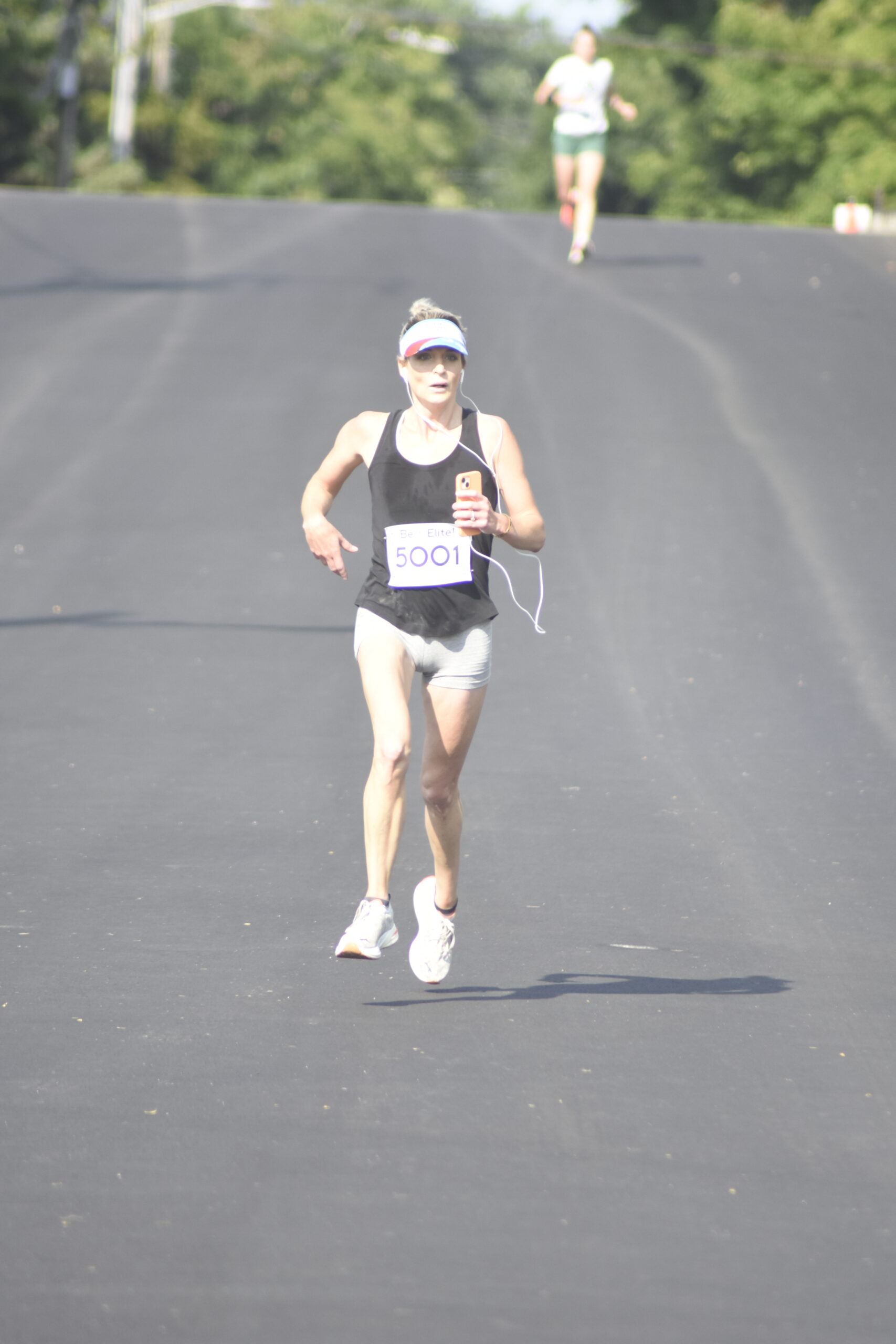 Kimberly Donahue of Myrtle Beach, South Carolina, and Westhampton Beach was the first female to cross the finish line of Saturday morning's race.   DREW BUDD