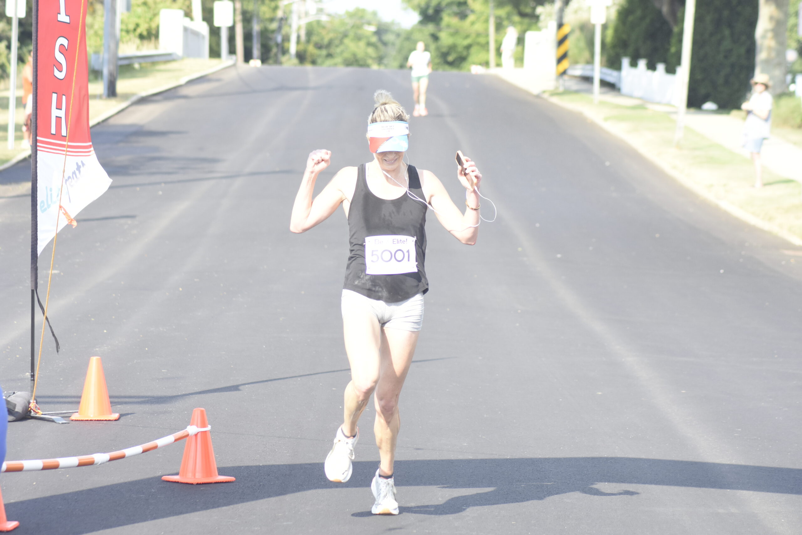 Kimberly Donahue of Myrtle Beach, South Carolina, and Westhampton Beach was the first female to cross the finish line of Saturday morning's race.   DREW BUDD