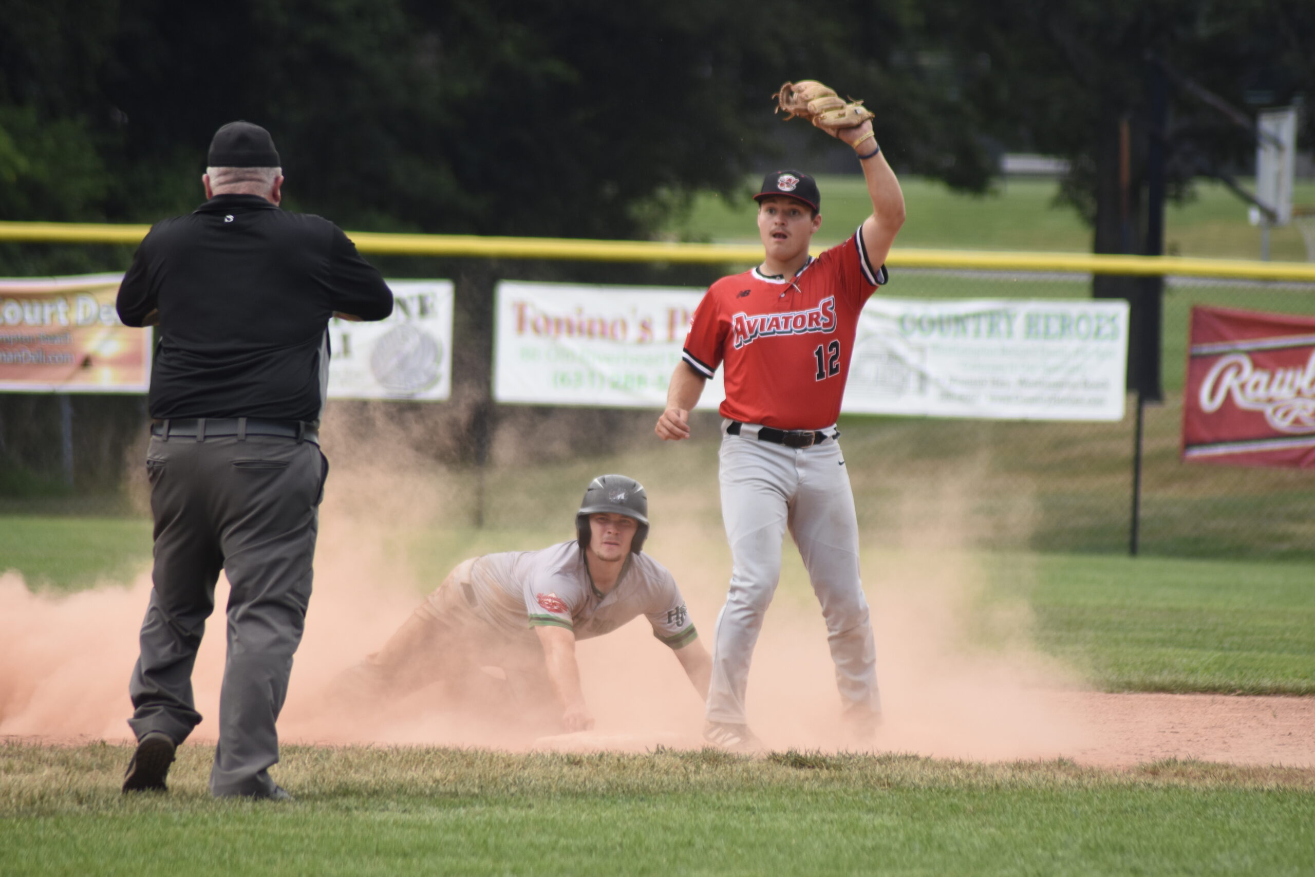Westhampton shortstop Sam Hill (UMass-Amherst) can't believe the safe call from the umpire on a close play at second base.   DREW BUDD