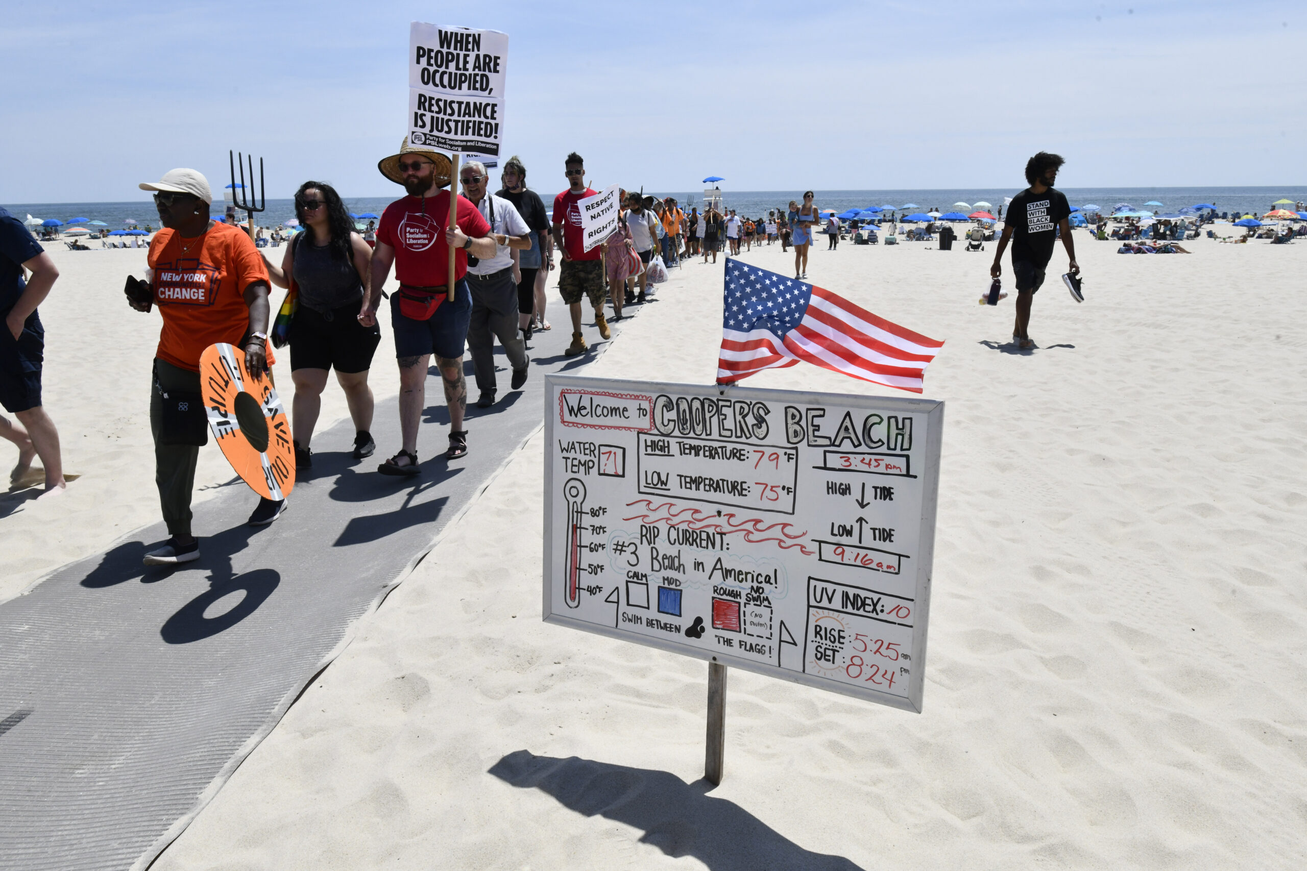 Members of the Shinnecock Nation hosted a #beachback protest at Coopers Beach on Saturday afternoon to demand that the Southampton Village Board give free beach access to tribal members.     DANA SHAW