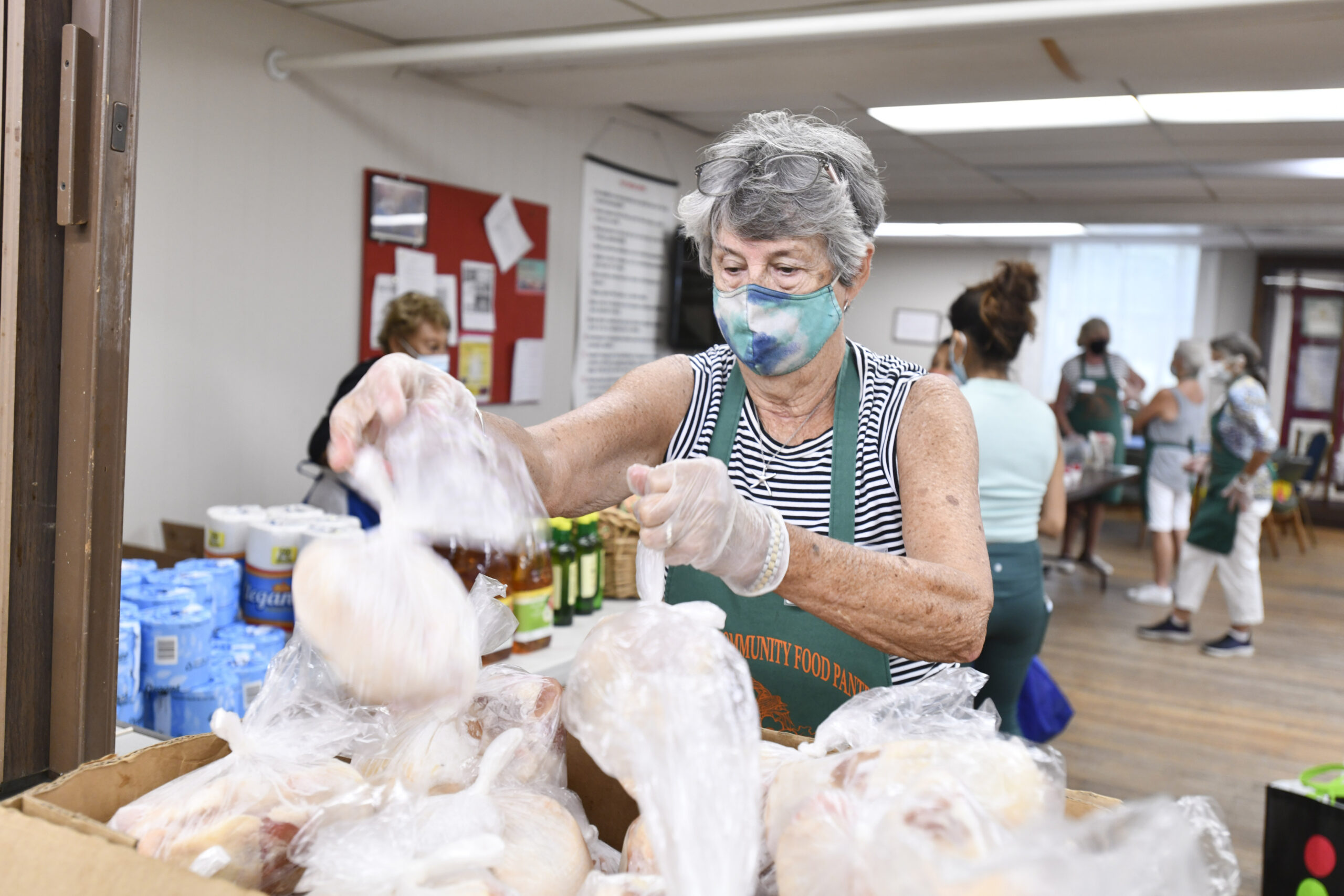 Volunteer Judy Lattanzio sorts items at the Sag harbor Community Food Pantry.  DANA SHAW