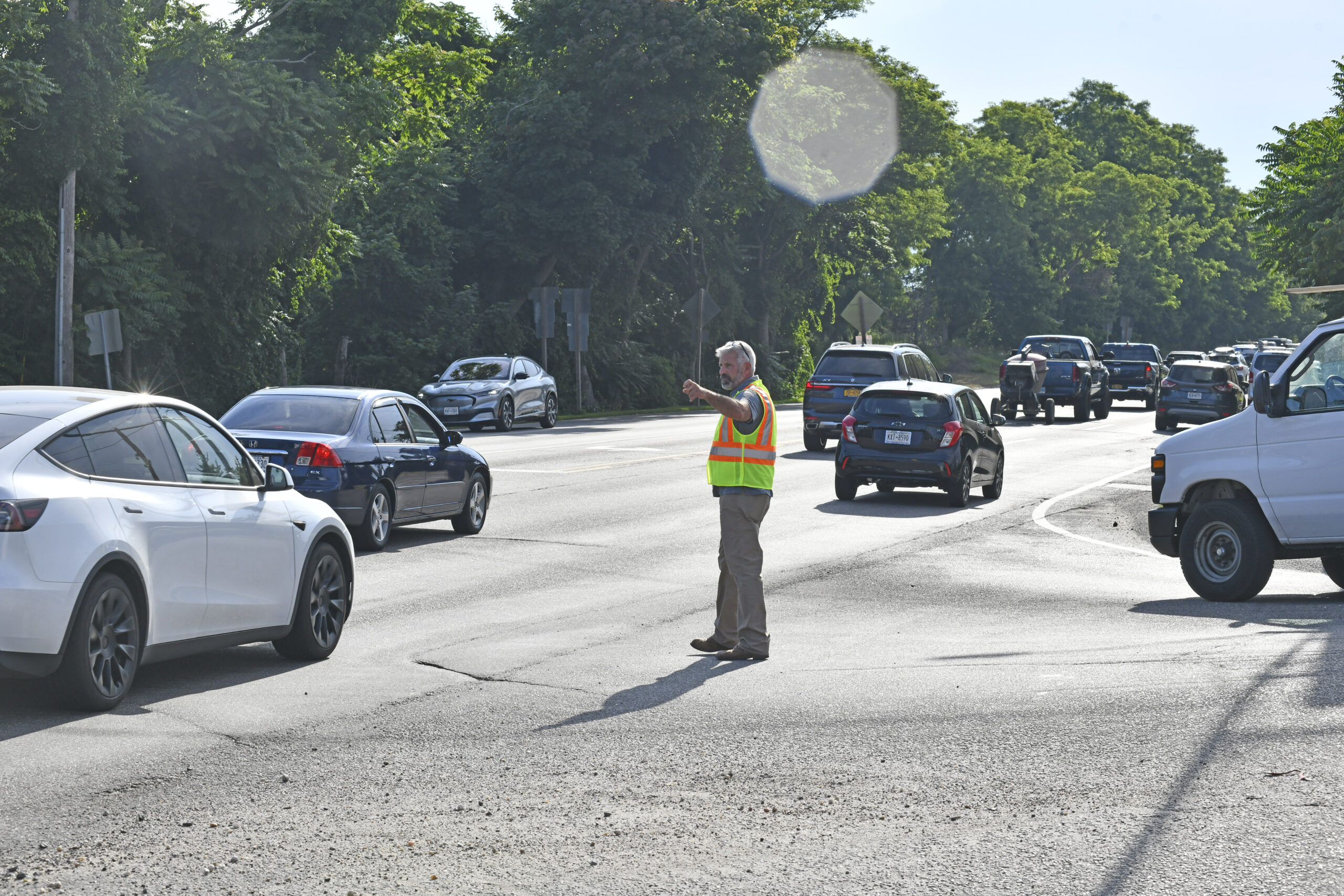 Southampton Town Highway Superintendent Charles McArdle at the Tuckahoe Road intersection on July 15, overseeing the effort to improve morning traffic flow on County Road 39 in Southampton.   DANA SHAW