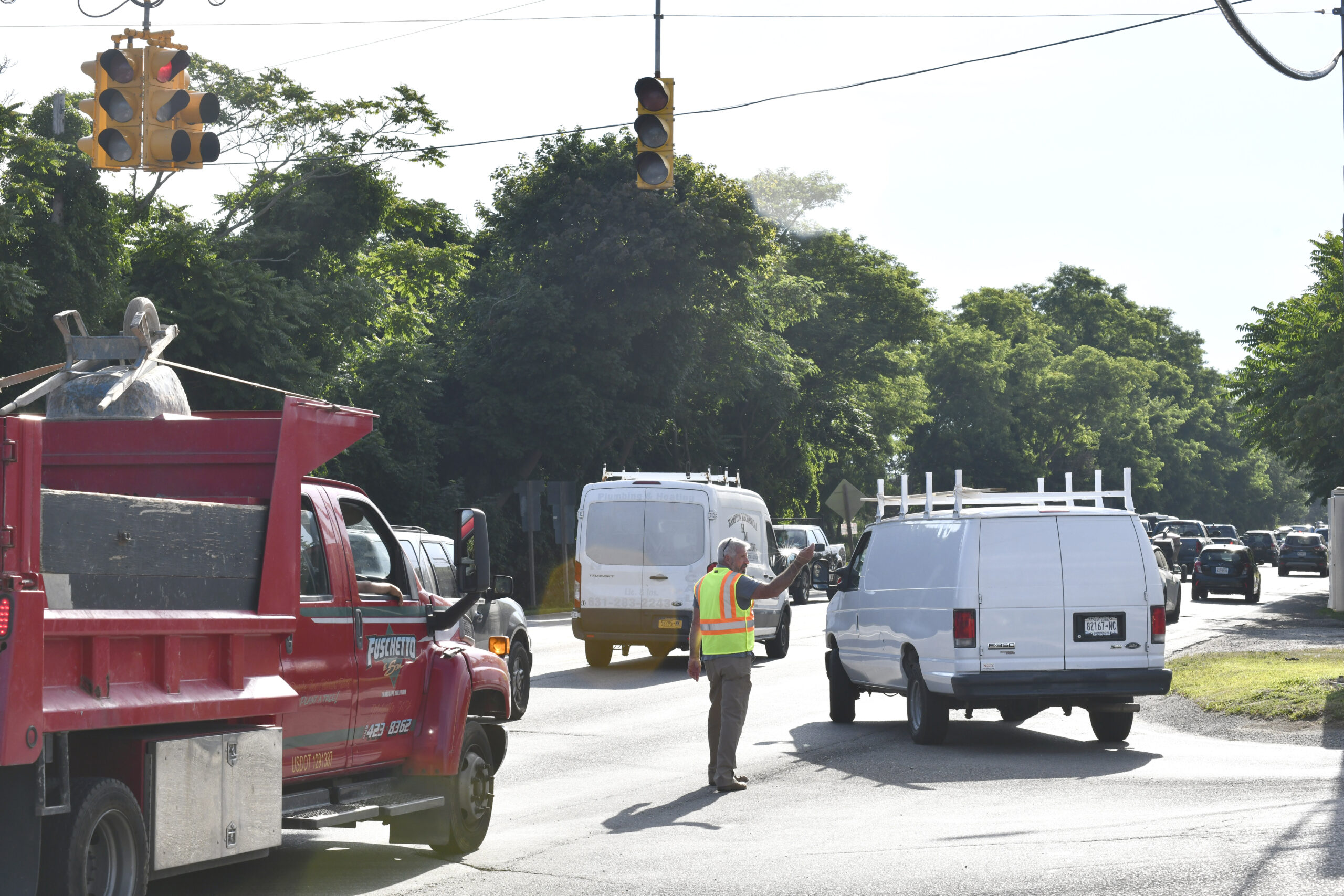 Southampton Town Highway Superintendent Charles McArdle at the Tuckahoe Road intersection on July 15, overseeing the effort to improve morning traffic flow on County Road 39 in Southampton.   DANA SHAW