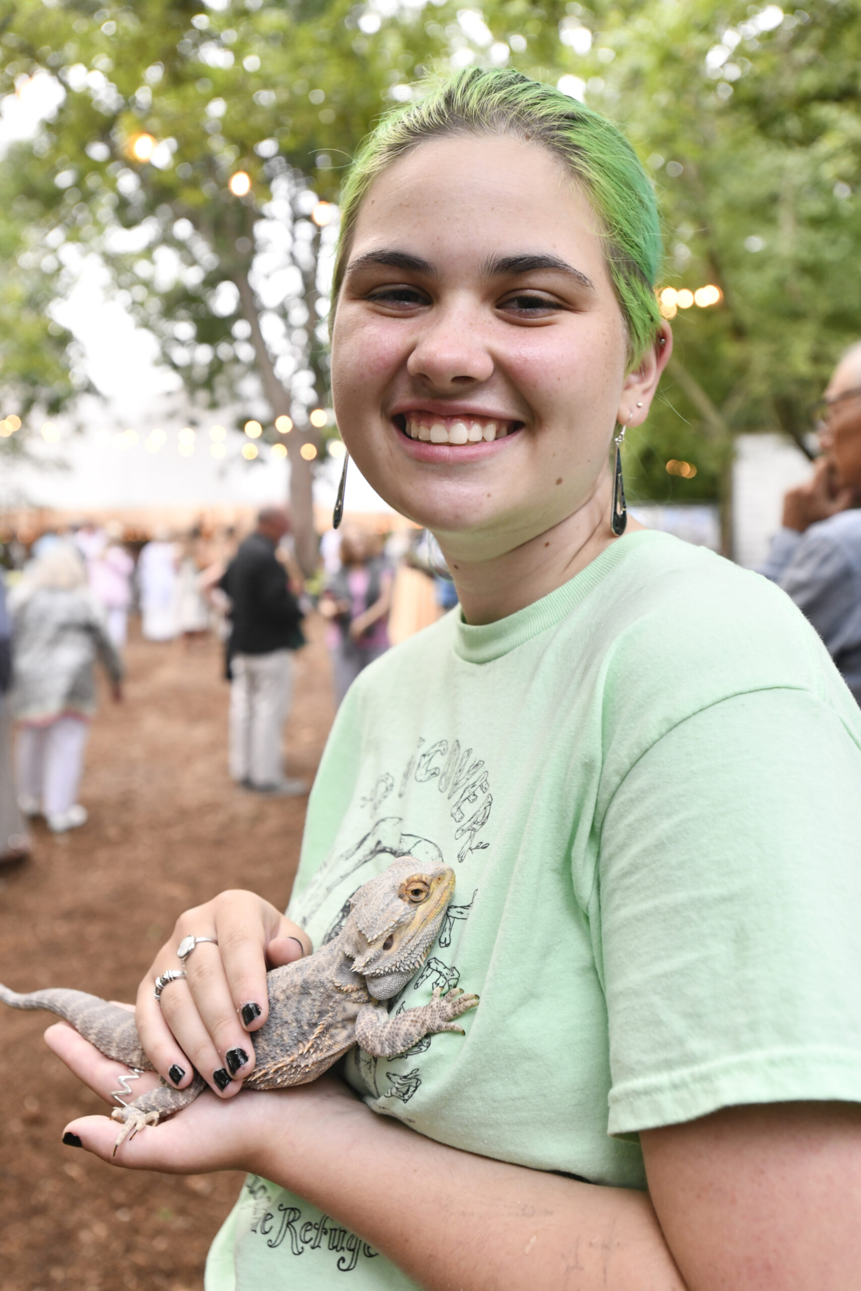 Moe Kennedy with a bearded dragon.