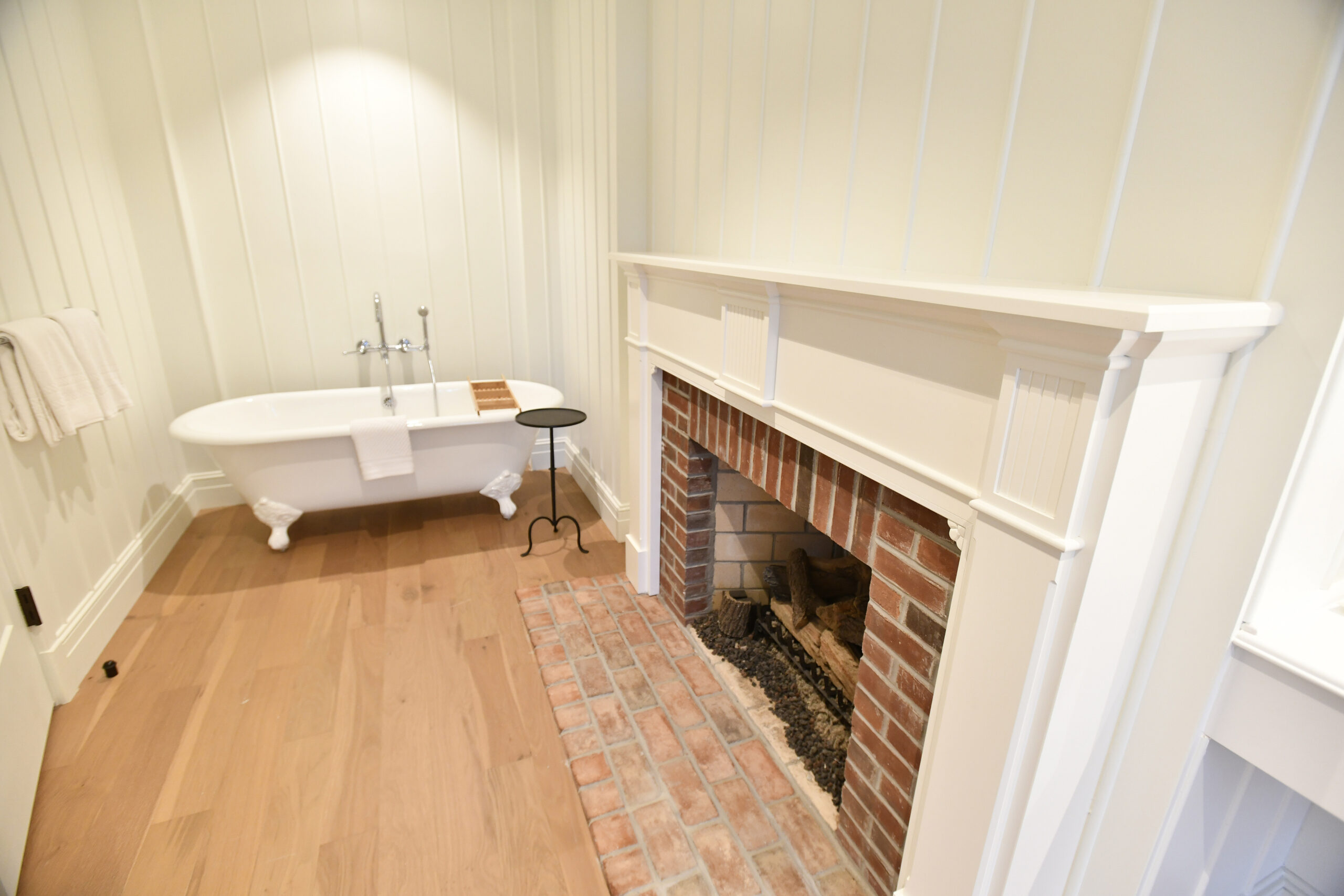 A fireplace adorns the bathroom in one of the Canoe Place in rooms/  DANA SHAW