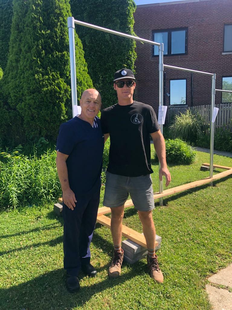 Dr. Kai Sturmann, left, and Drew Harvey after the completion of a fitness station at Quannacut,  the drug and alcohol treatment center at Stony Brook Eastern Long Island Hospital in Greenport. PHOTO COURTESY DAWGPATCH BANDITS