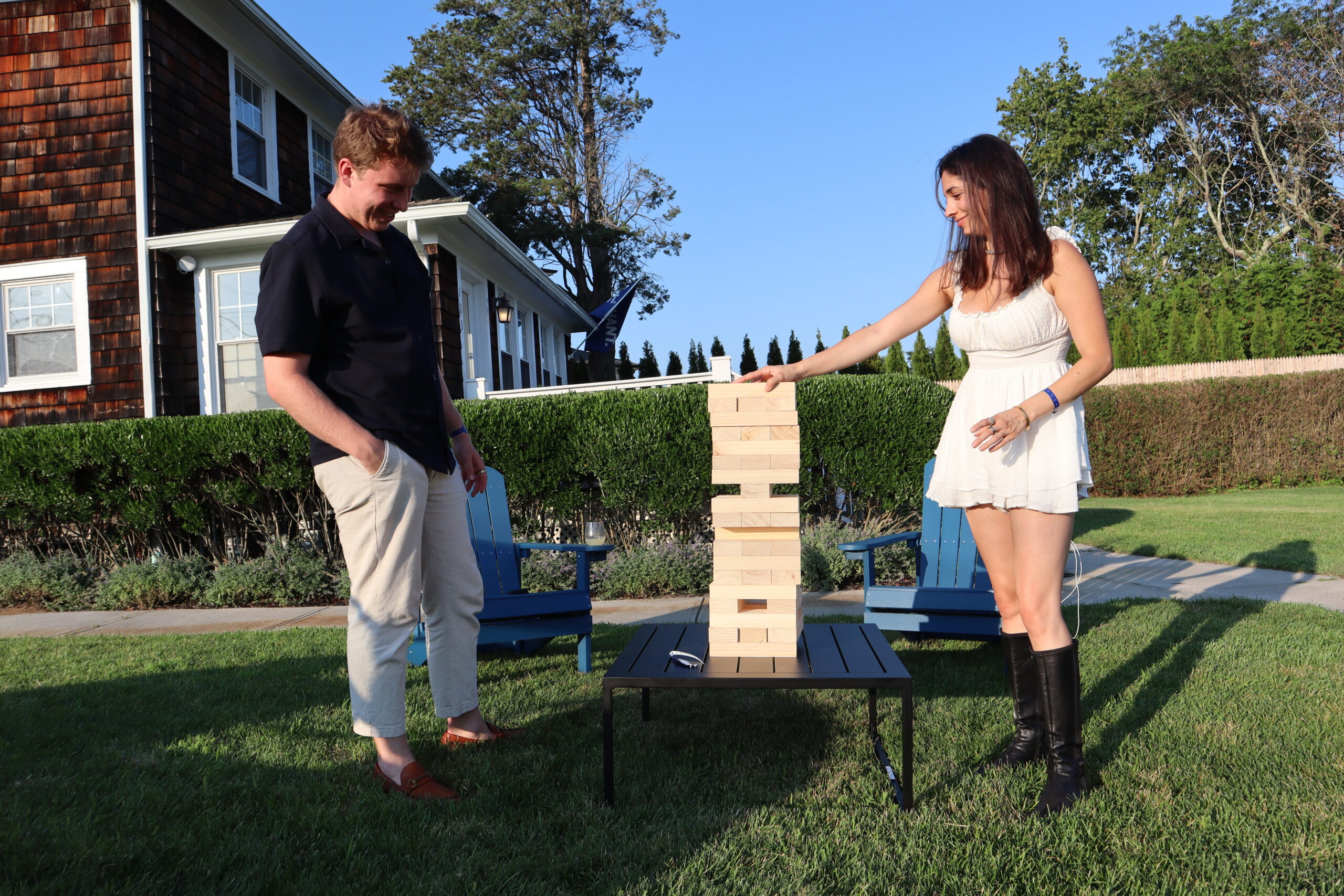 Cody Boone, a video producer at Serhant, and Nikki Arya, a photographer at Serhant, play giant Jenga together at the launch party. 
 MEGAN NAFTALI