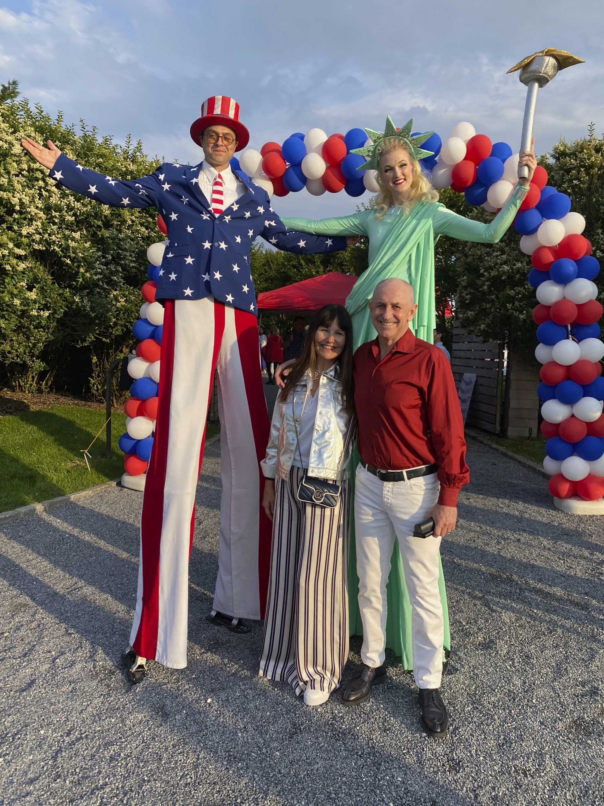 Greeters at the American Picnic with Renee Harbers Liddell and Chris Liddell.   GREG D'ELIA