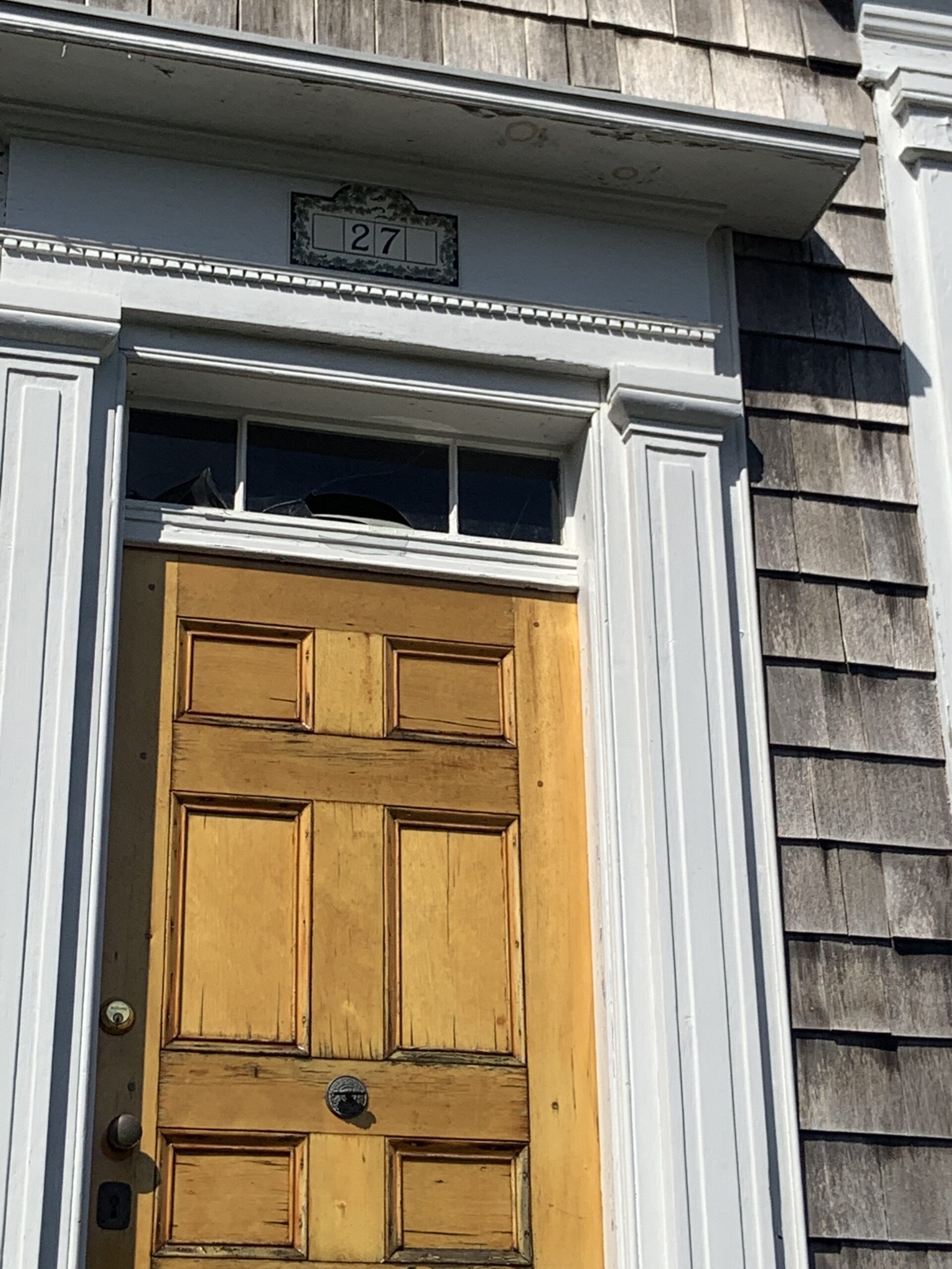 A small window above the door has been broken on the vacant house. STEPHEN J. KOTZ