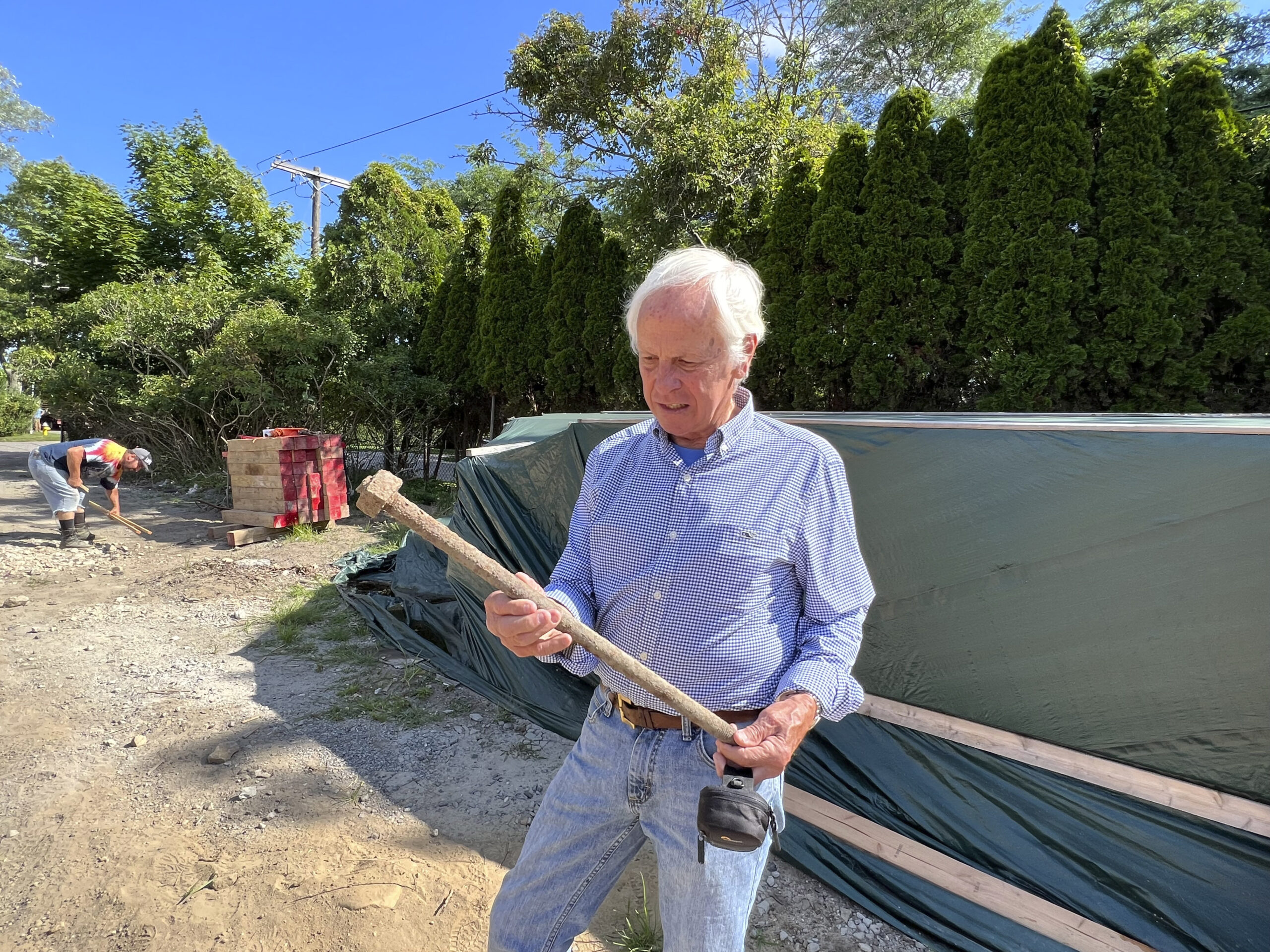 Larry Jones with a bolt from one of the windmill blades.  DANA SHAW