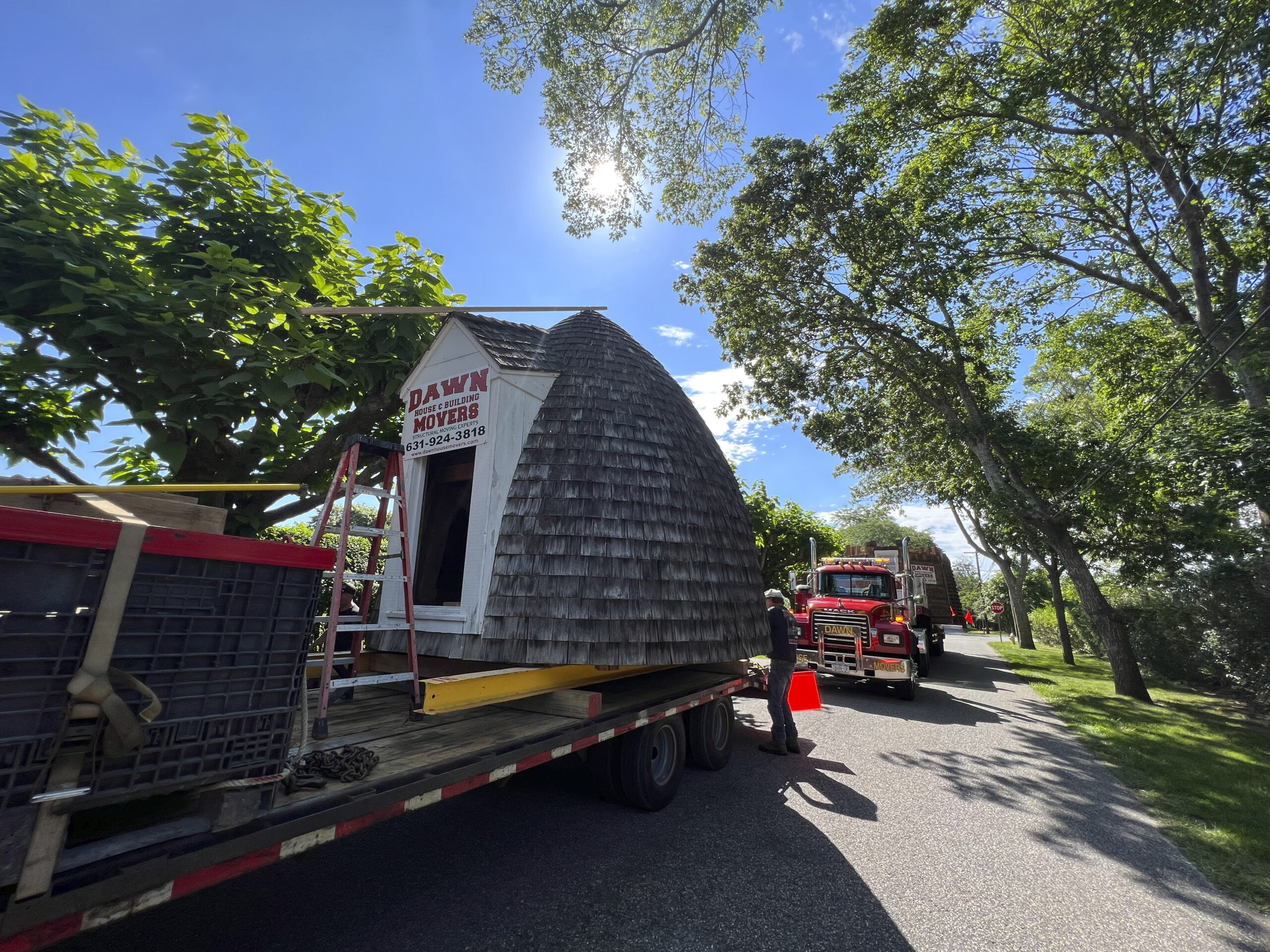 The trucks lined up to transport the windmill down Main Street to the Great Lawn.  DANA SHAW