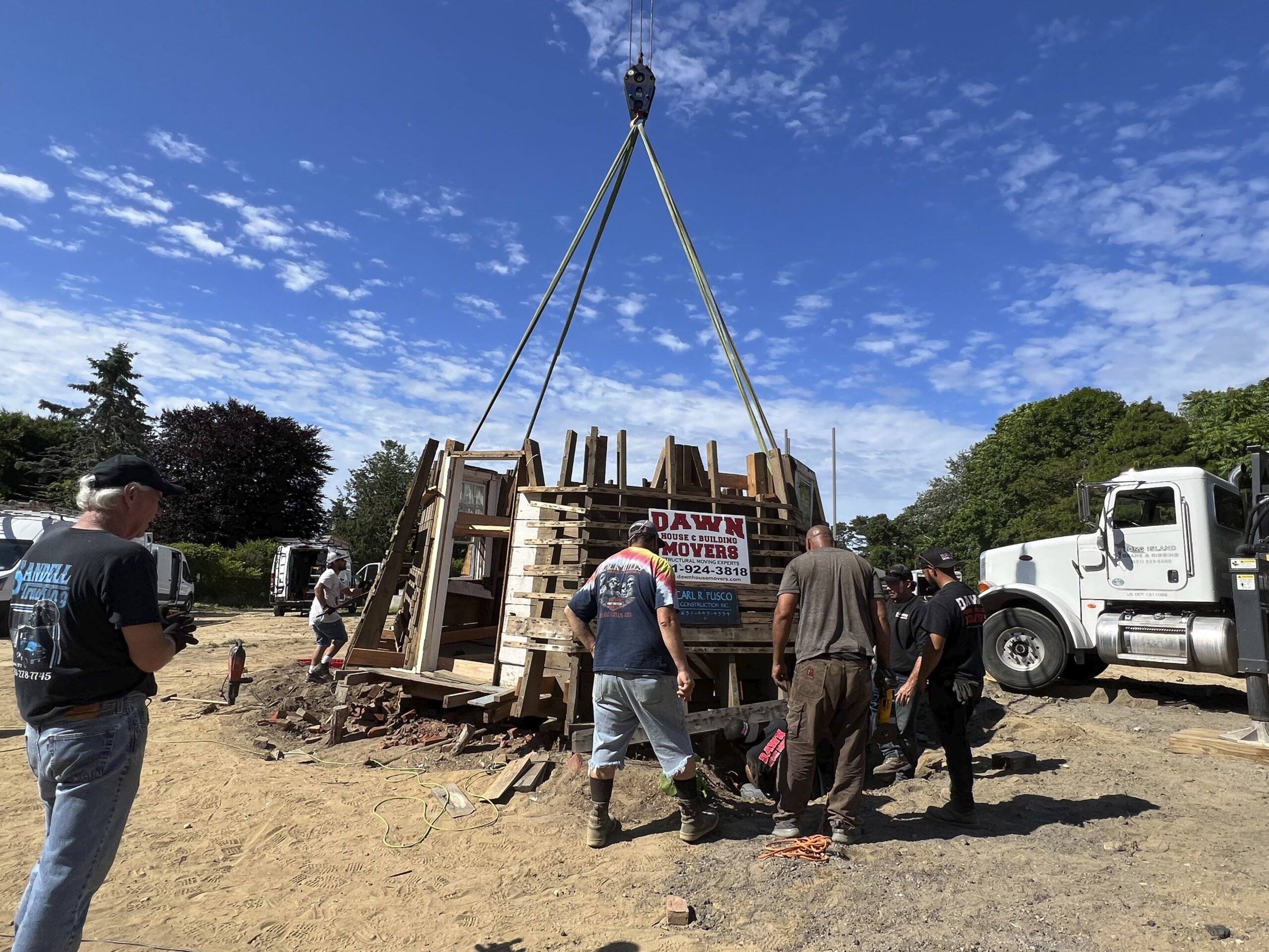 The crew from Dawn prepares to move the last section of the windmill.  DANA SHAW