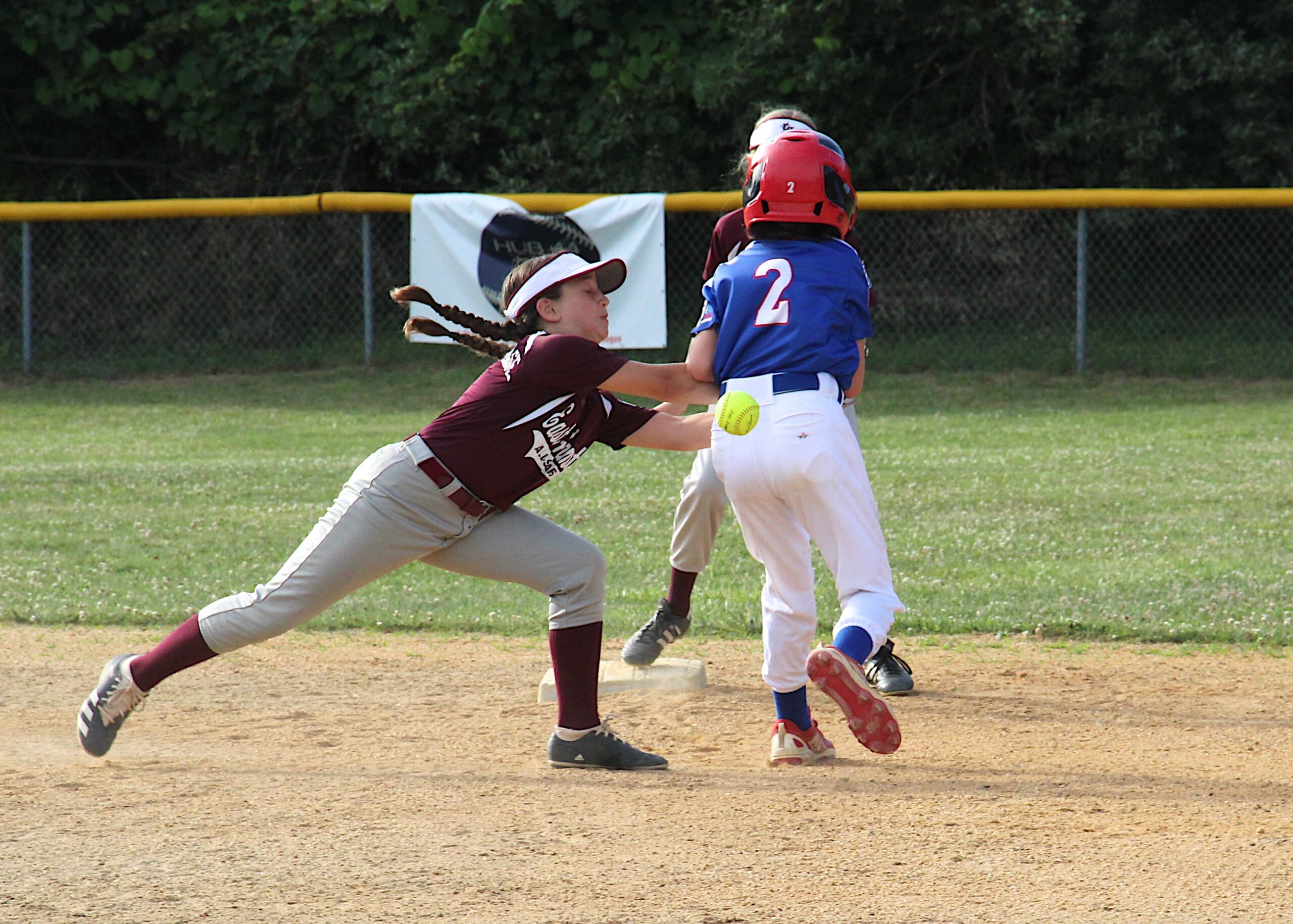 East Hampton shortstop Cameron Dawson tries to tag a North Shore player at second base.  KYRIL BROMLEY