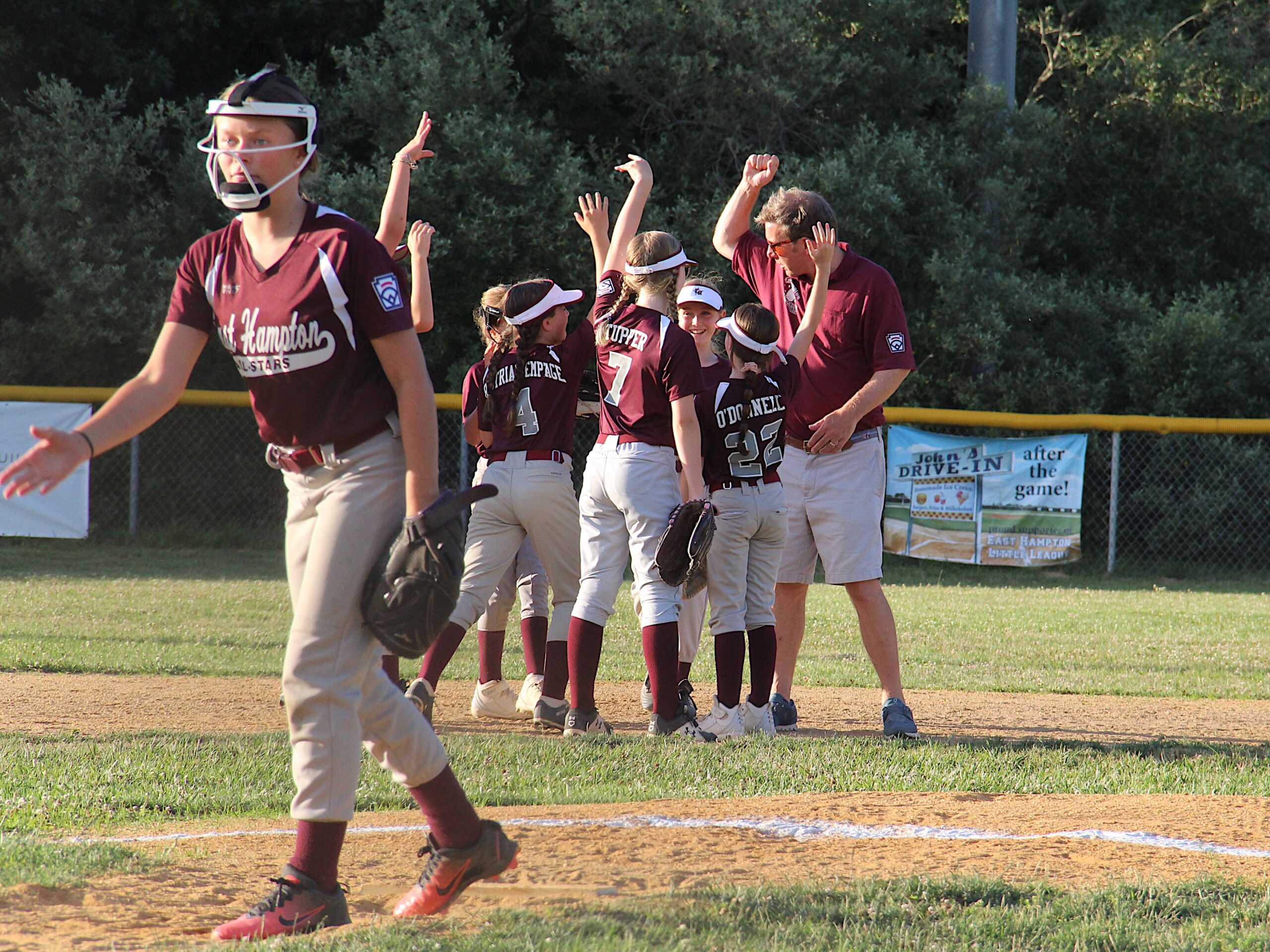 The East Hampton Minors softball All-Stars defeated North Shore Little League, 22-15, in game one of the District 36 Championships at Pantigo Field on July 6, but then lost the second game two days later, allowing North Shore to claim the district title.  KYRIL BROMLEY