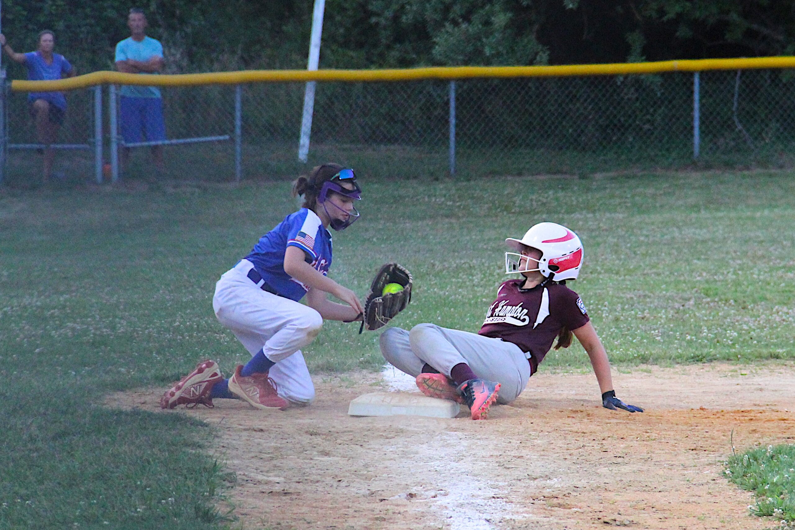 East Hampton's Allison Rade slides into third base.  KYRIL BROMLEY